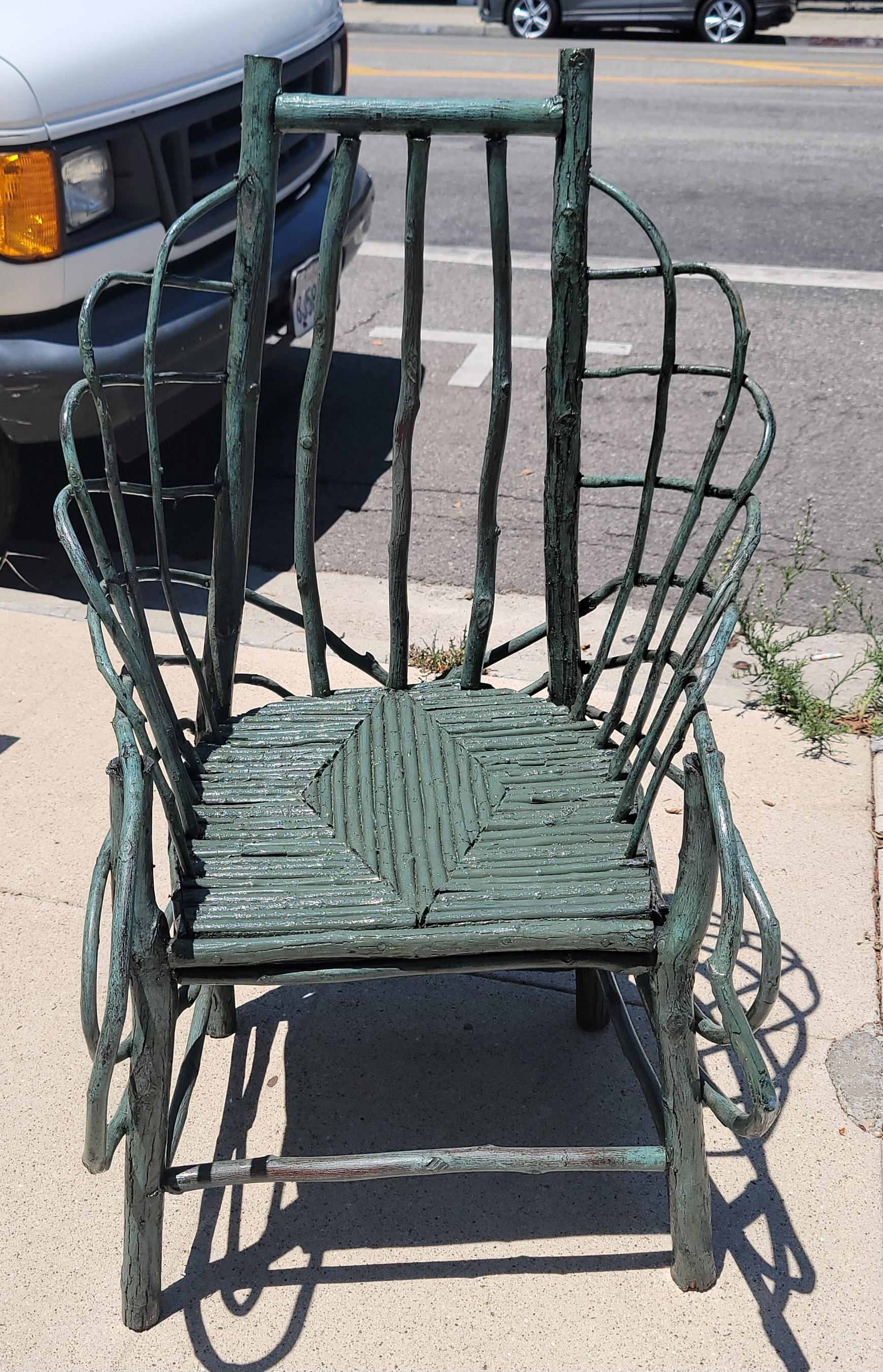 This folky hand made 19Thc chair is in fine condition in original blue paint. There is a coat of weather protector so could go inside or outside of your home. This twig chair was found in Pennsylvania and has an amazing inlaid twig design seat .