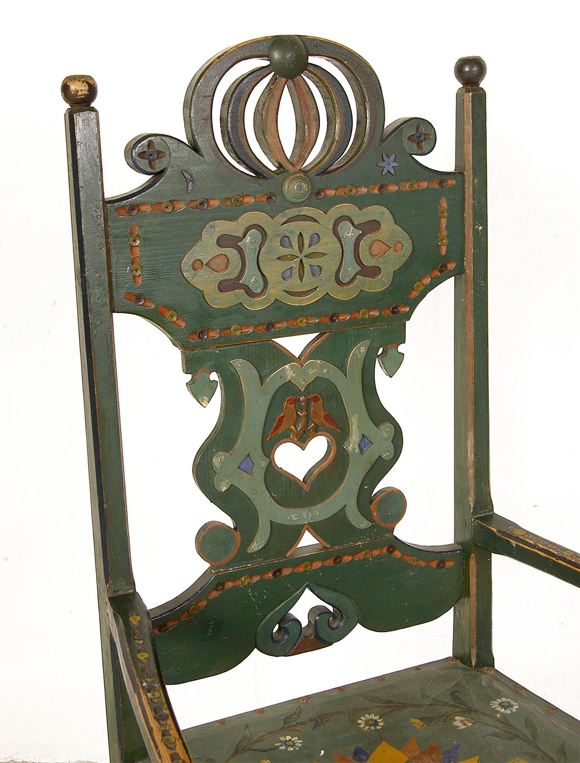 Still wearing its original, and beautifully worn multicolored polychrome paint, this rare Swedish chair epitomises the Folk Art style that blossomed in Sweden during the 18th and 19th century. This particular example has been well worn, and has