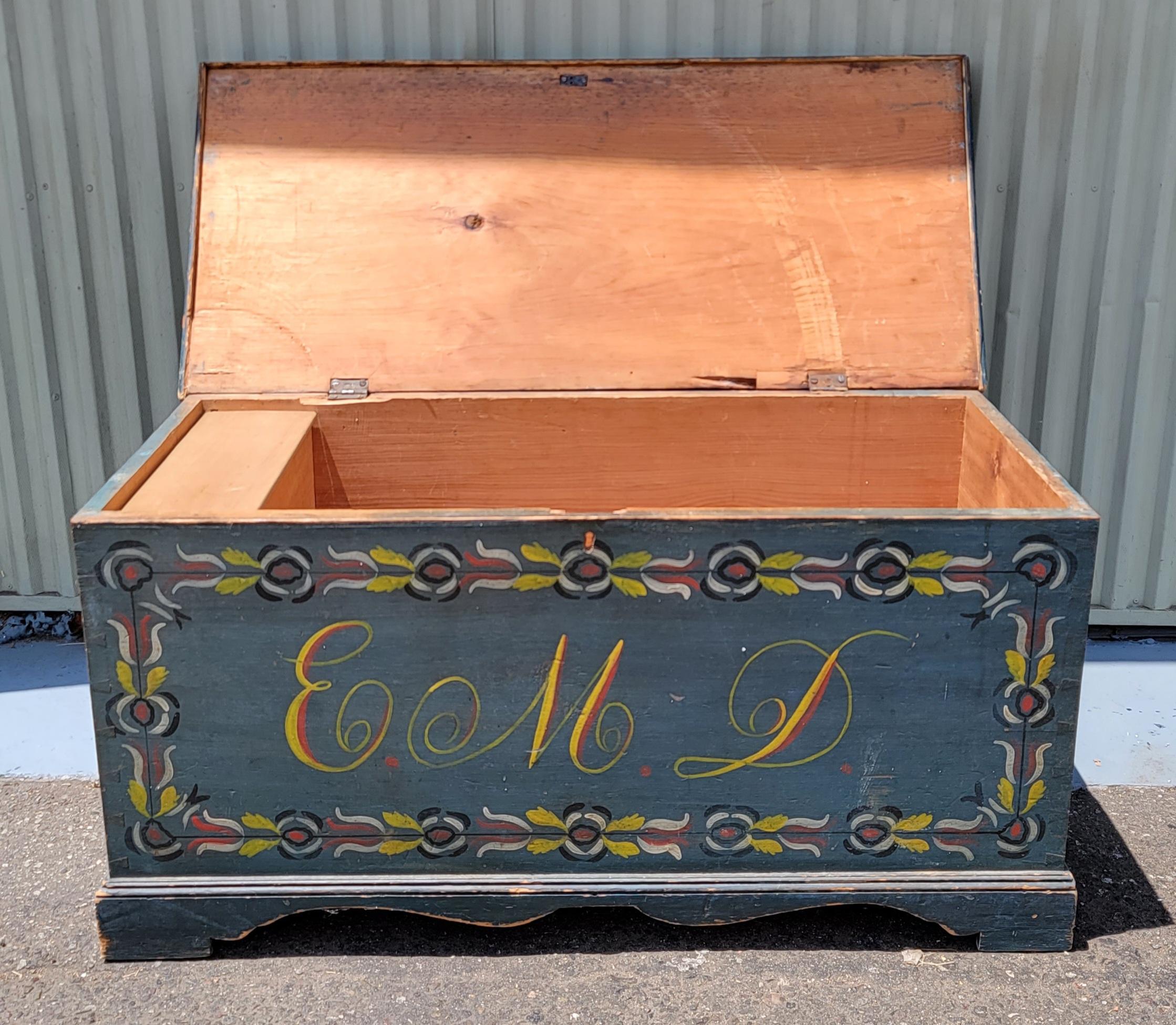 Paint decorated blanket chest. Schoharie County, New York. Blue
paint with yellow, red black and green. Painted initials E.M.D. on
front. Dovetail construction.
Condition: Excellent condition. Repair to approx 6