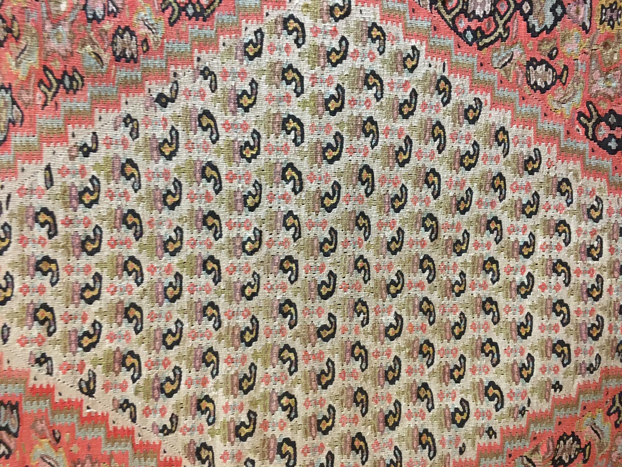 Senneh Kilim rugs are prized for their intricate compositions, exceptional weaves and fine craftsmanship. This particular one has all the bells and whistles, as well as a lovely color palette and is in fine condition.