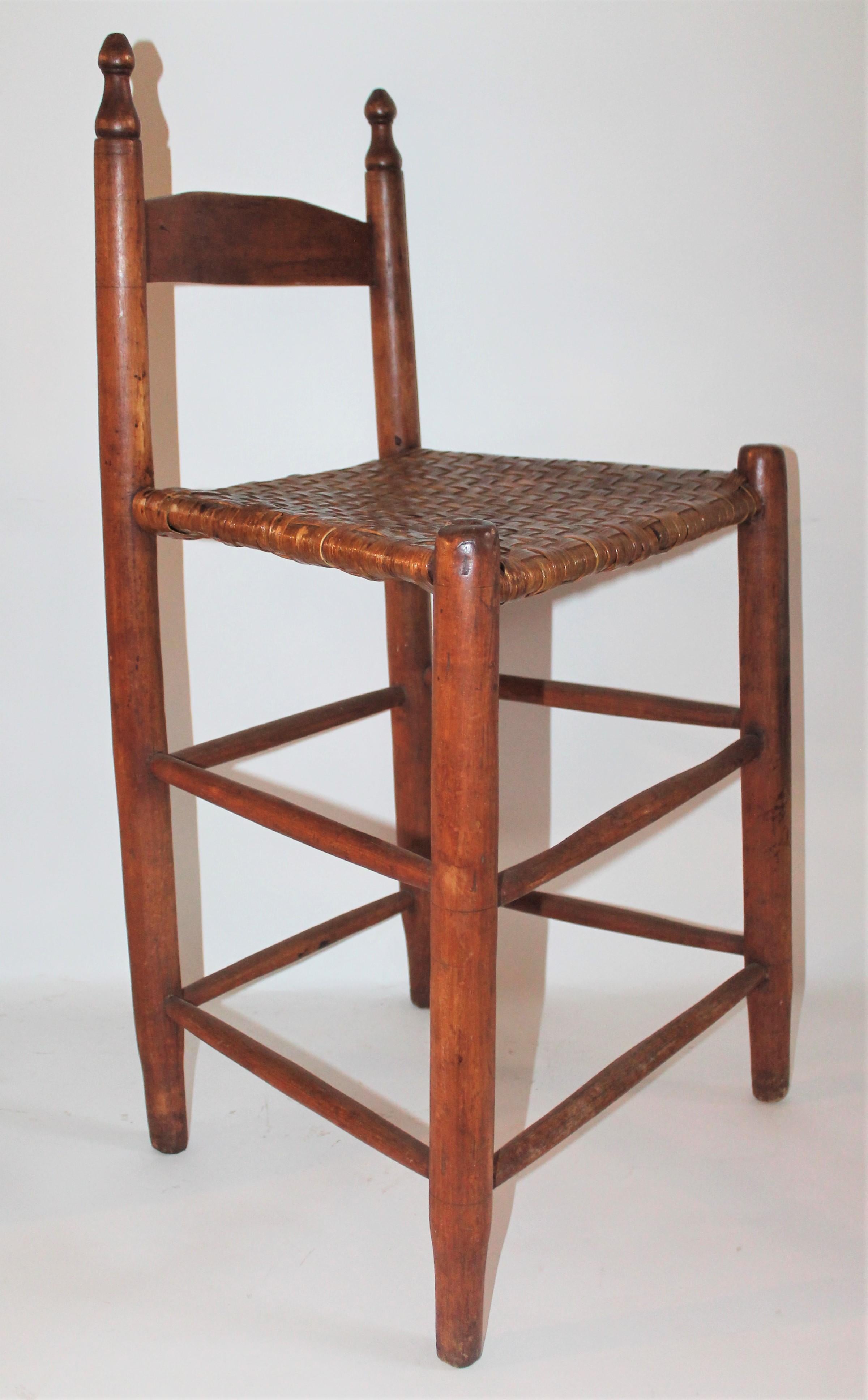 This fine simple high seat chair is in good condition and super comfortable the natural wood has a very nice aged patina. The edge of the side of the seat has minor splints in the original handwoven splint seat. This chair is very sturdy though.