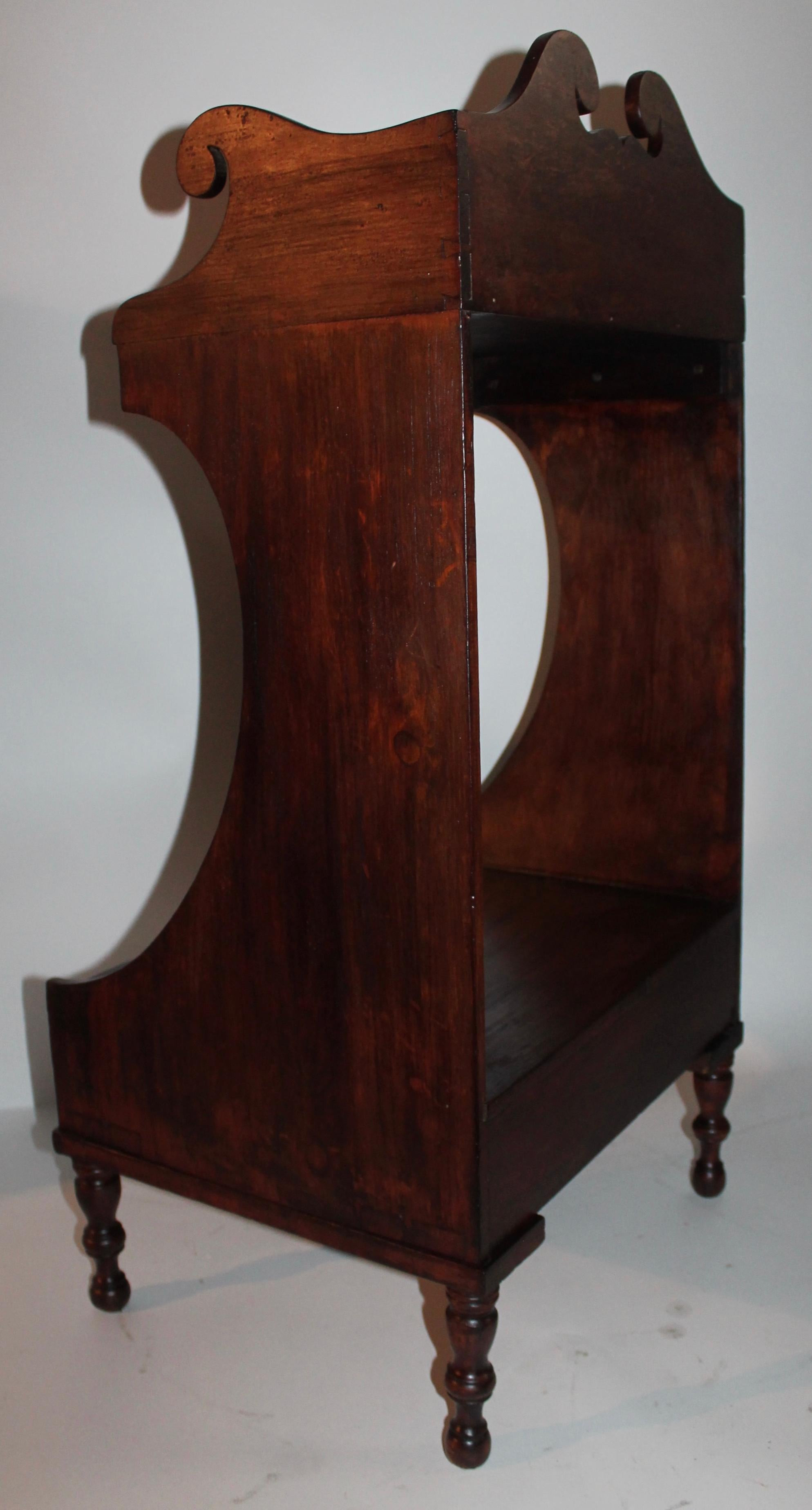 19th century side table with dovetailed case and lower casing as well. It retains a old stained surface and all original hardware. The cutout are amazing and quite unusual. The condition is very good and sturdy. Makes a great side table or