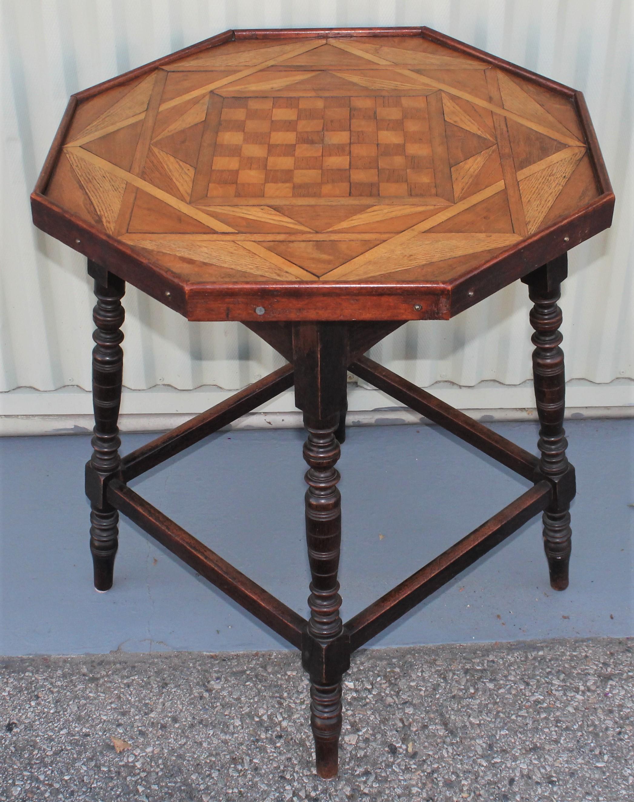 This 19th century side table or gaming table has an inlaid checker board top. Fantastic turned legs and Fine sturdy condition. Fantastic form.