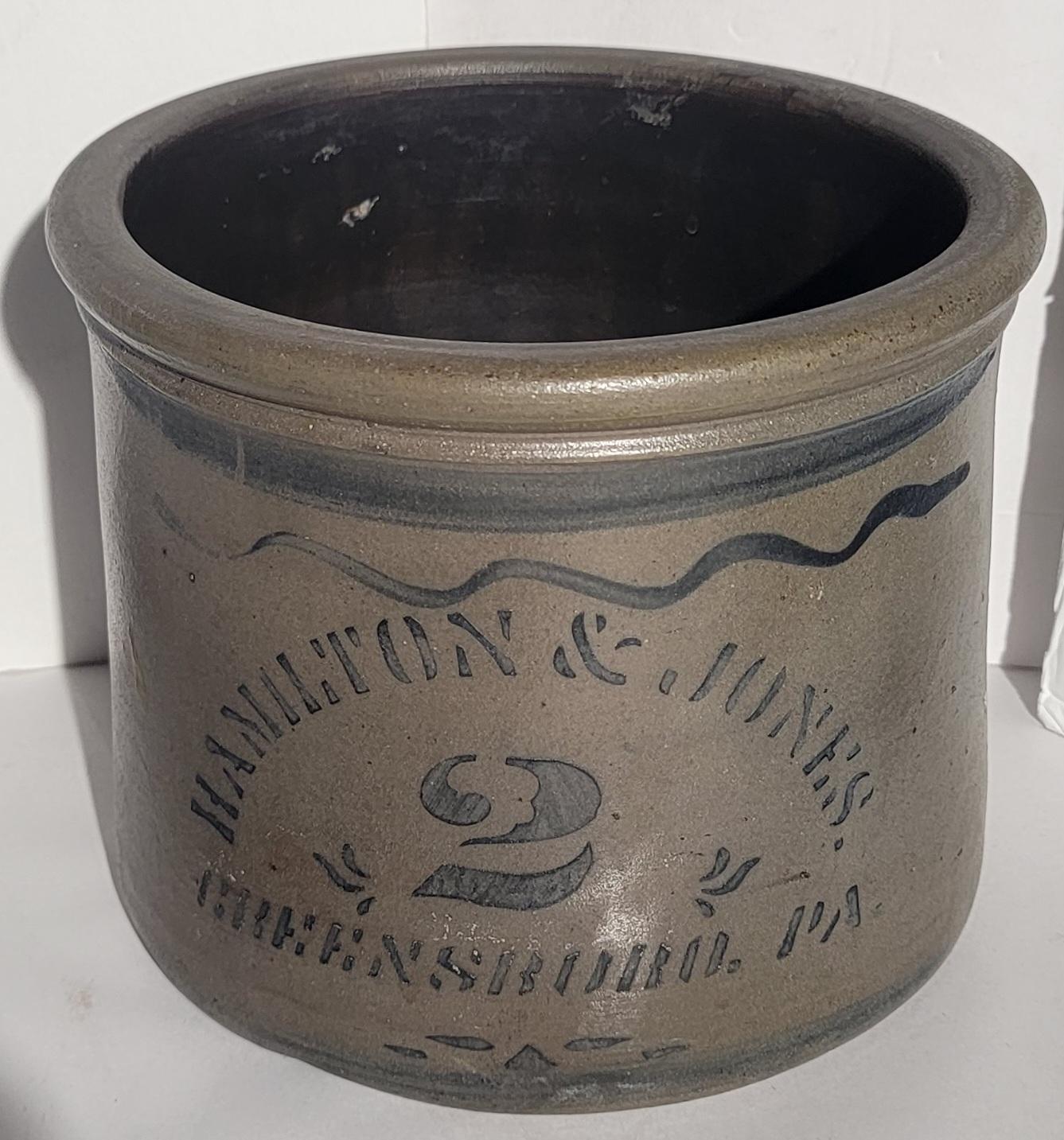 This fine country crock is decorated & Signed Hamilton & Jones Greensboro,Pa. and has a big 2 on the front.This two gallon crock has blue decoration & could be a cake or butter crock.The condition is mint.