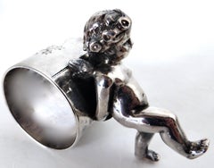 19thC Silver Plated Victorian Figural Napkin Ring; "Winged Cherub Pushing Ring"