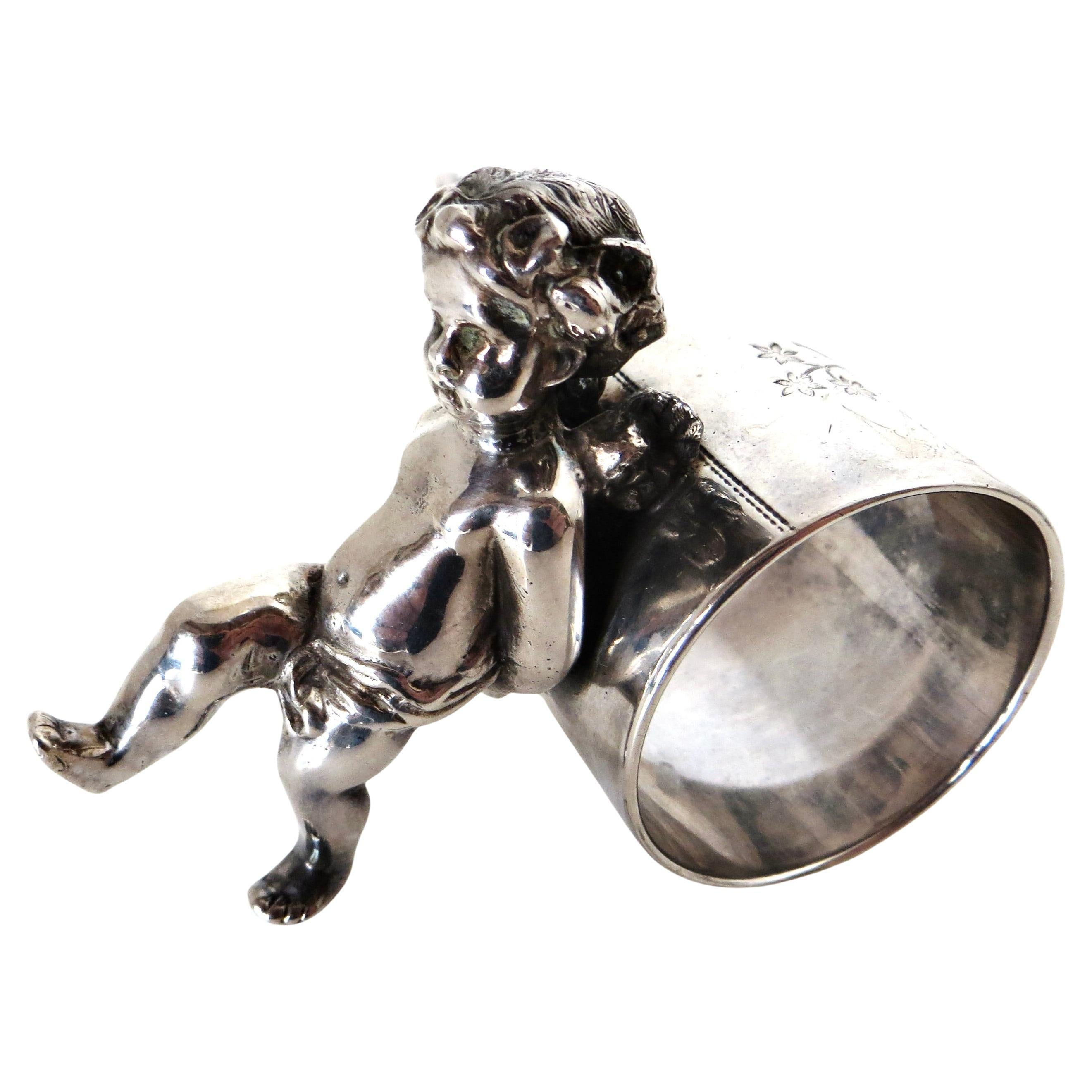19thC Silver Plated Victorian Figural Napkin Ring; "Winged Cherub Pushing Ring"