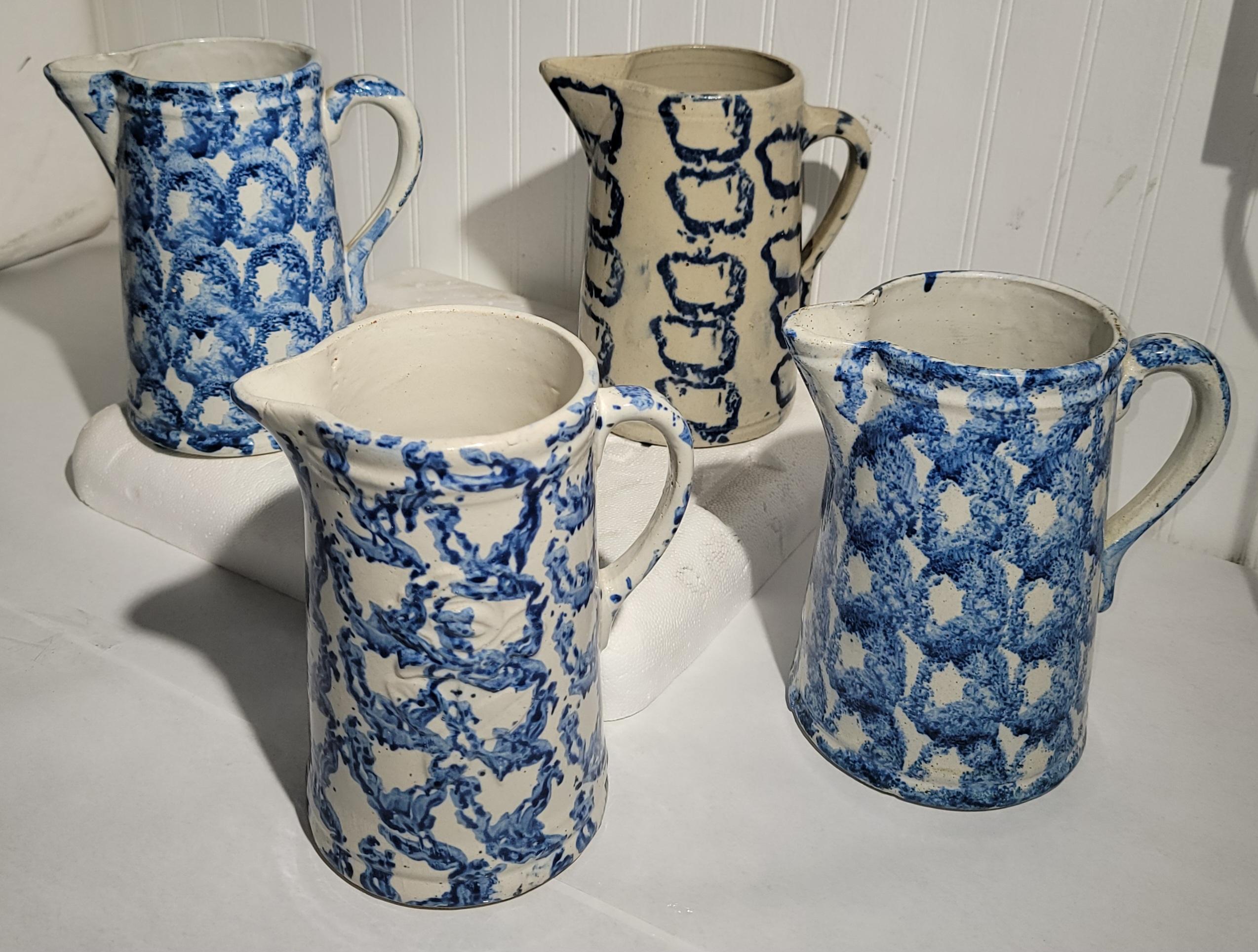 19Thc Sponge ware pottery pitchers in smoke ring patterns. These blue & white pitchers are very rare and most unusual to find in such good condition. We can individually for $895 each or $3250. for the set of four.