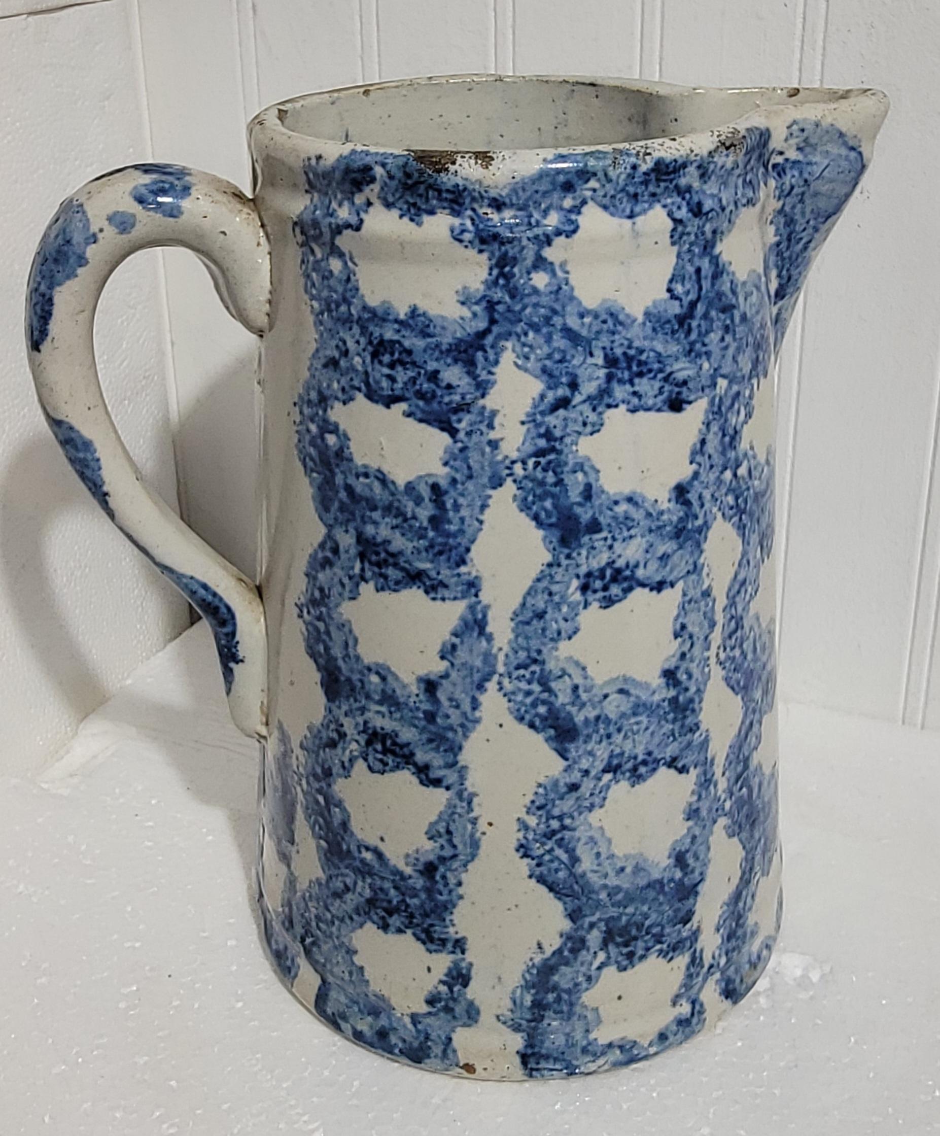 19th century smoke ring patter pitcher. Wonderful blue rings showcasing the smoke ring pattern in a beautiful blue with white background. Great pitcher in great condition.