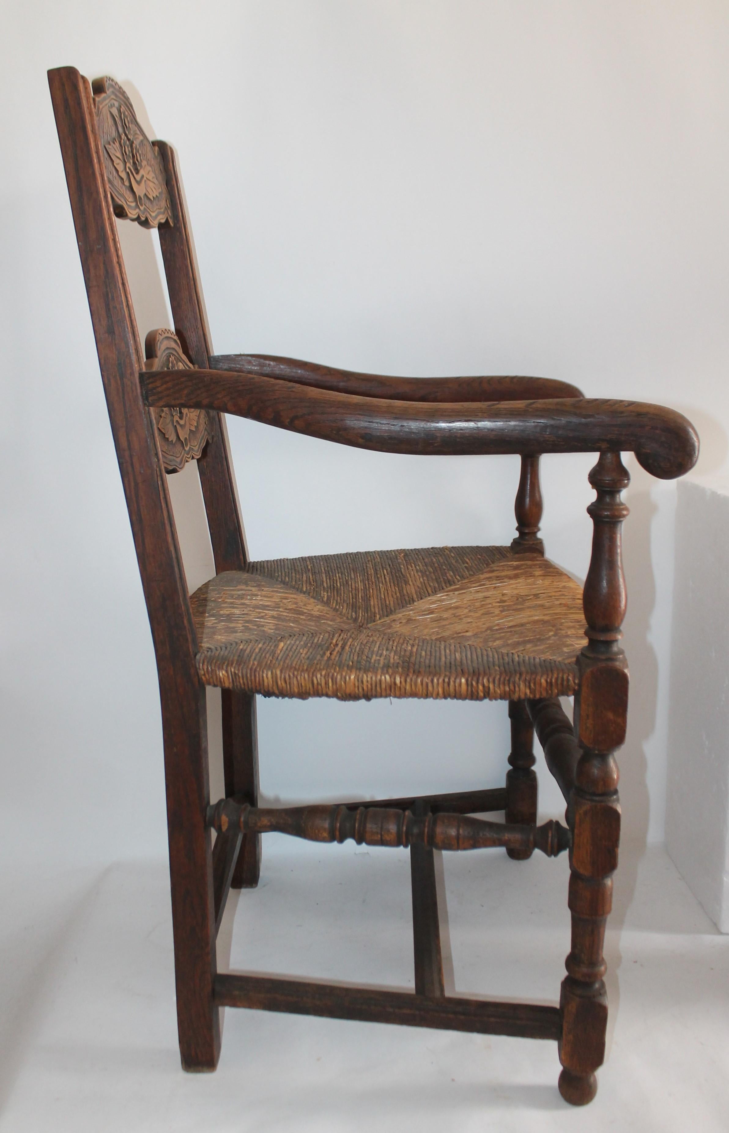 19th century hand carved Mexican /American style armchair. Was found in New Mexico. The seat is the original rush seat.