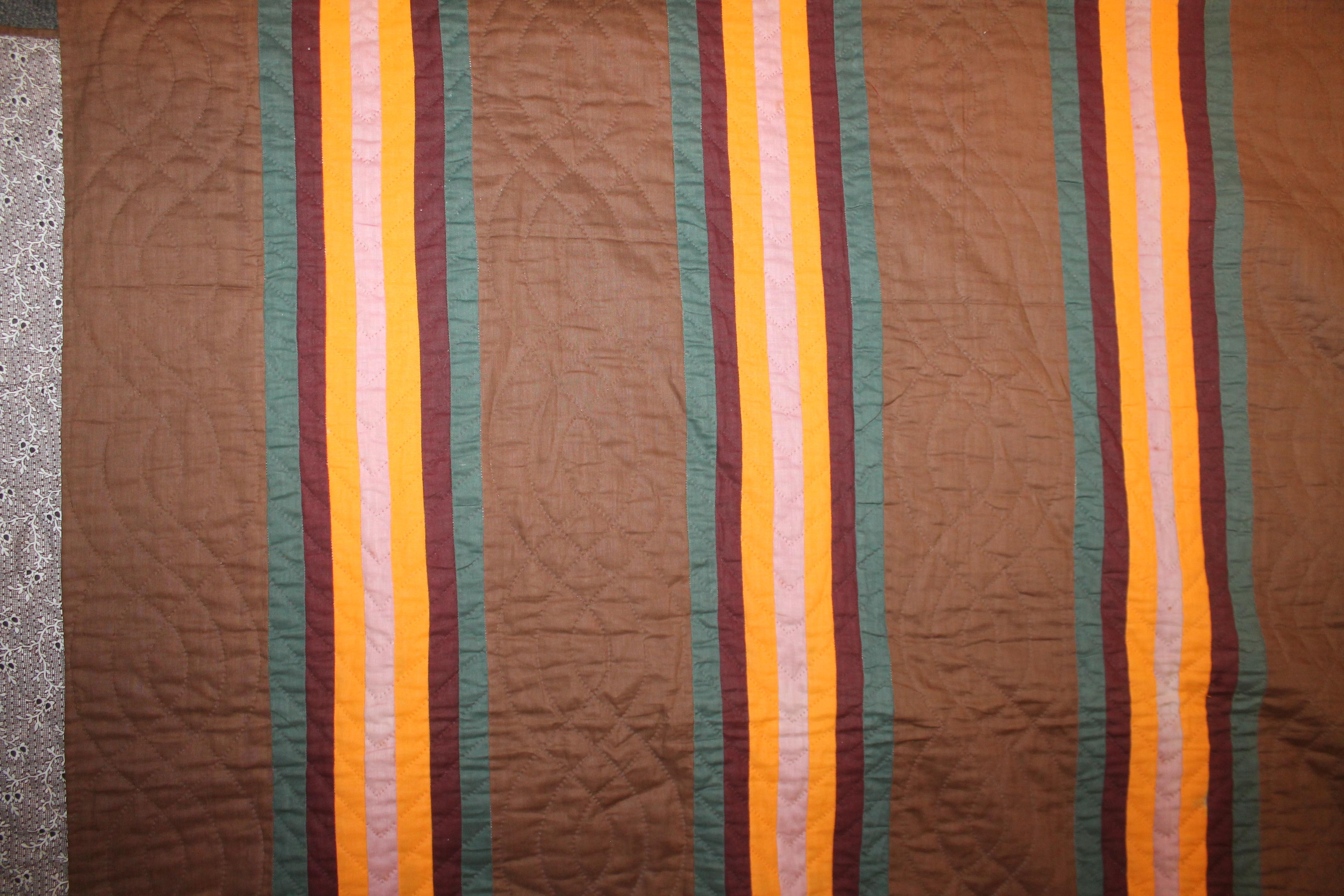 This fine split bars quilt was made in Lancaster County, Pennsylvania and is from the third quarter of the 19th century. It is quite rare the colors on a chocolate brown ground. It is in very good condition. These quilts were typically made in that