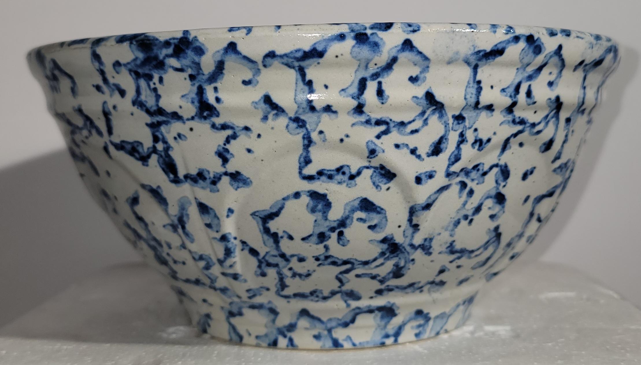 19thc sponge ware bowl with light light blue design. The blue color is not overpowering allowing the background color to be shown. there is a scalloped texture to the going throughout the sides. Wonderful made bowl with great wear and patina. 