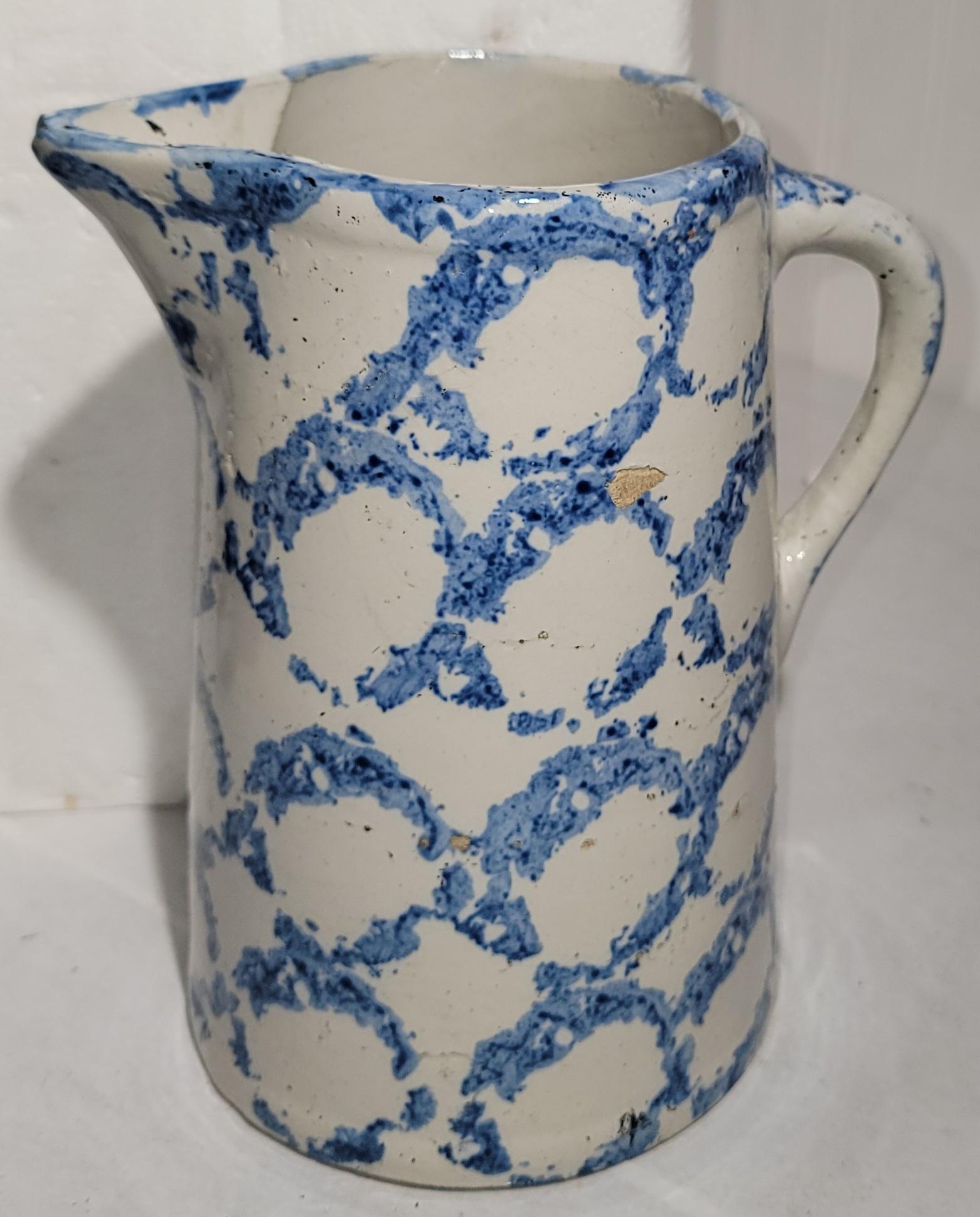 Both pitchers measures approx. - 8d x 6.5w x 9 h Smoke Ring pattern pitchers with tiny bites on the base.Very good condition.Sold as a pair.