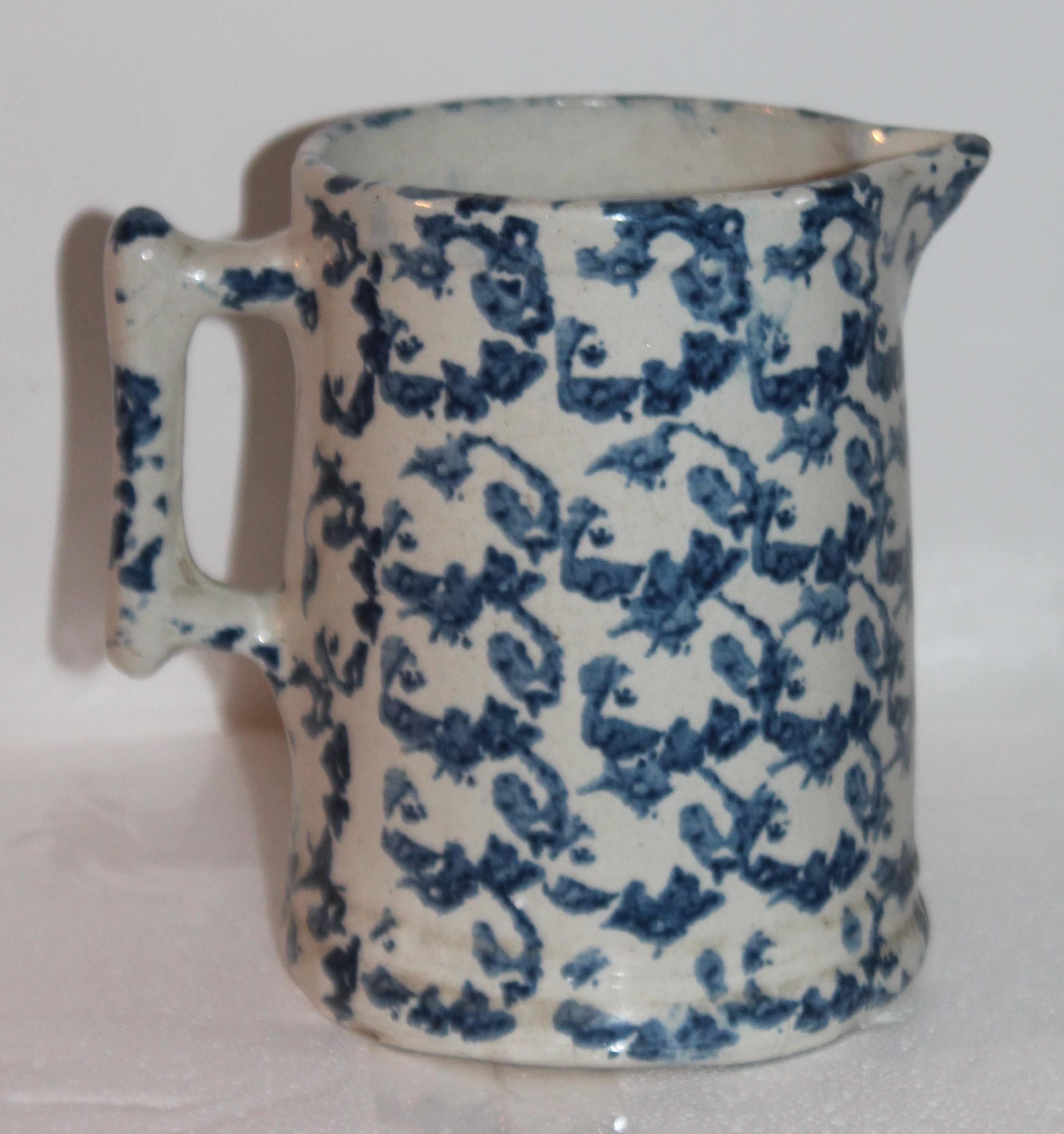 This fine and early 19th century patterned sponge ware pottery pitcher is in great condition. Most unusual pattern looks like flowers.