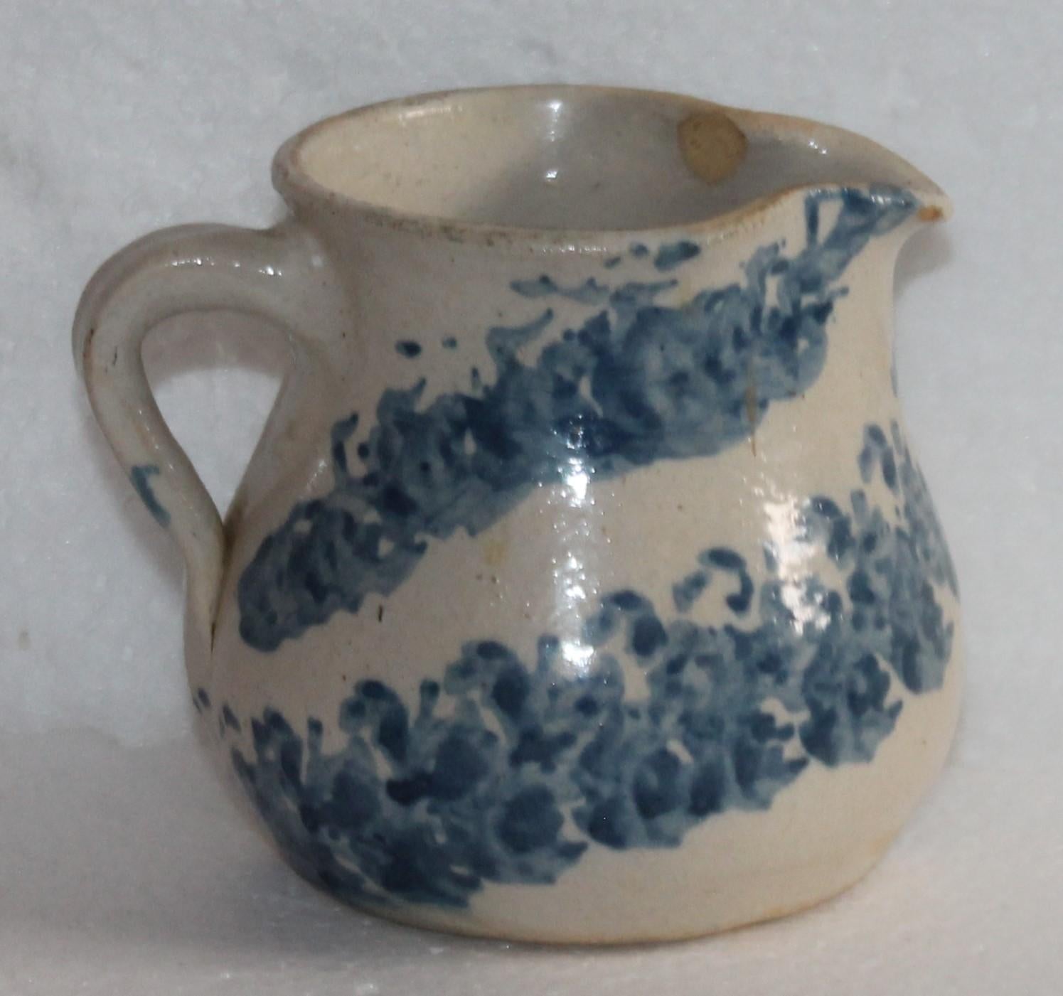 19th century rare form sponge ware milk pitcher in pottery. This is a handmade piece. The condition is very good with a minor small chip on the inner lip inside the pitcher near the spout. Very minor and not noticed from the outside.
