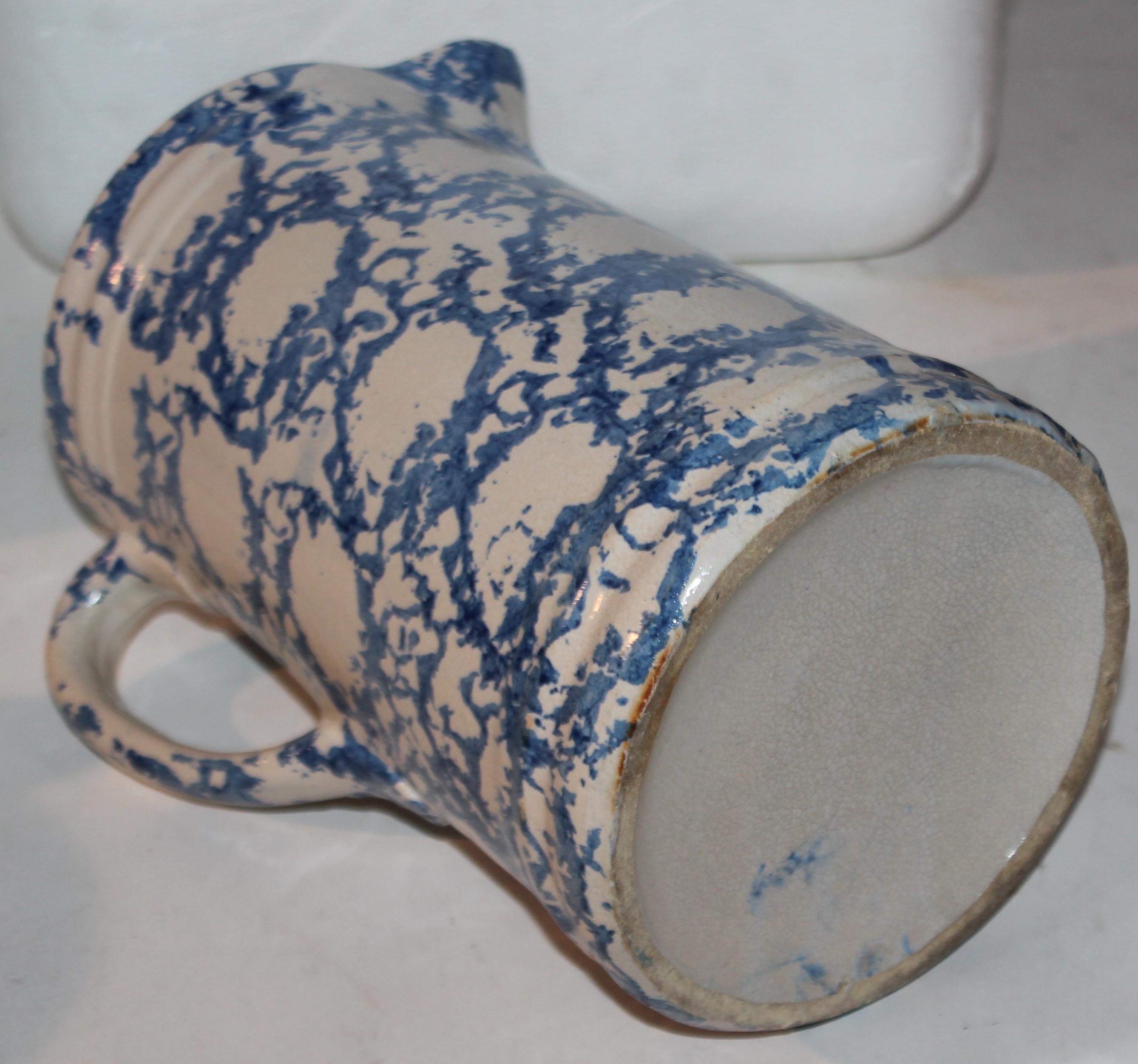 19thc Sponge ware thick smoke ring patter pitcher
The pattern is a thick blue sponge ring with a cream color background.