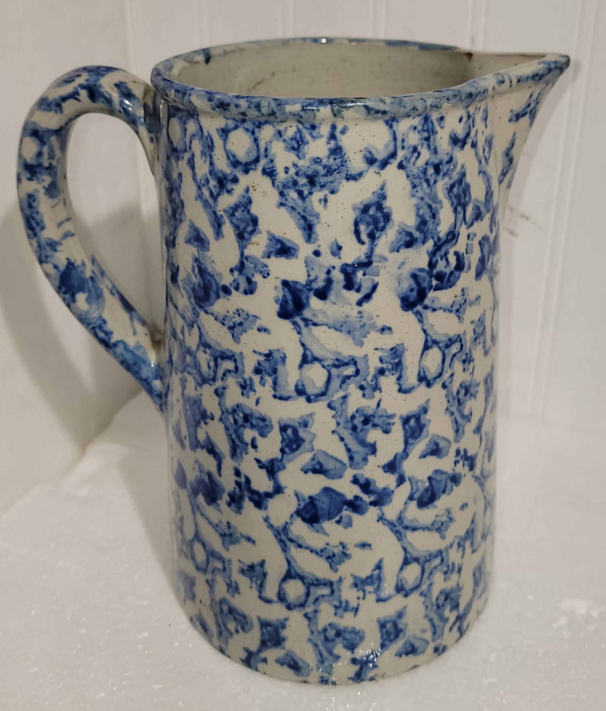 19th century hand made and hand painted sponge ware pitcher. beautiful blue and white color pattern. Great for decoration or to be used as a flower vase. 
