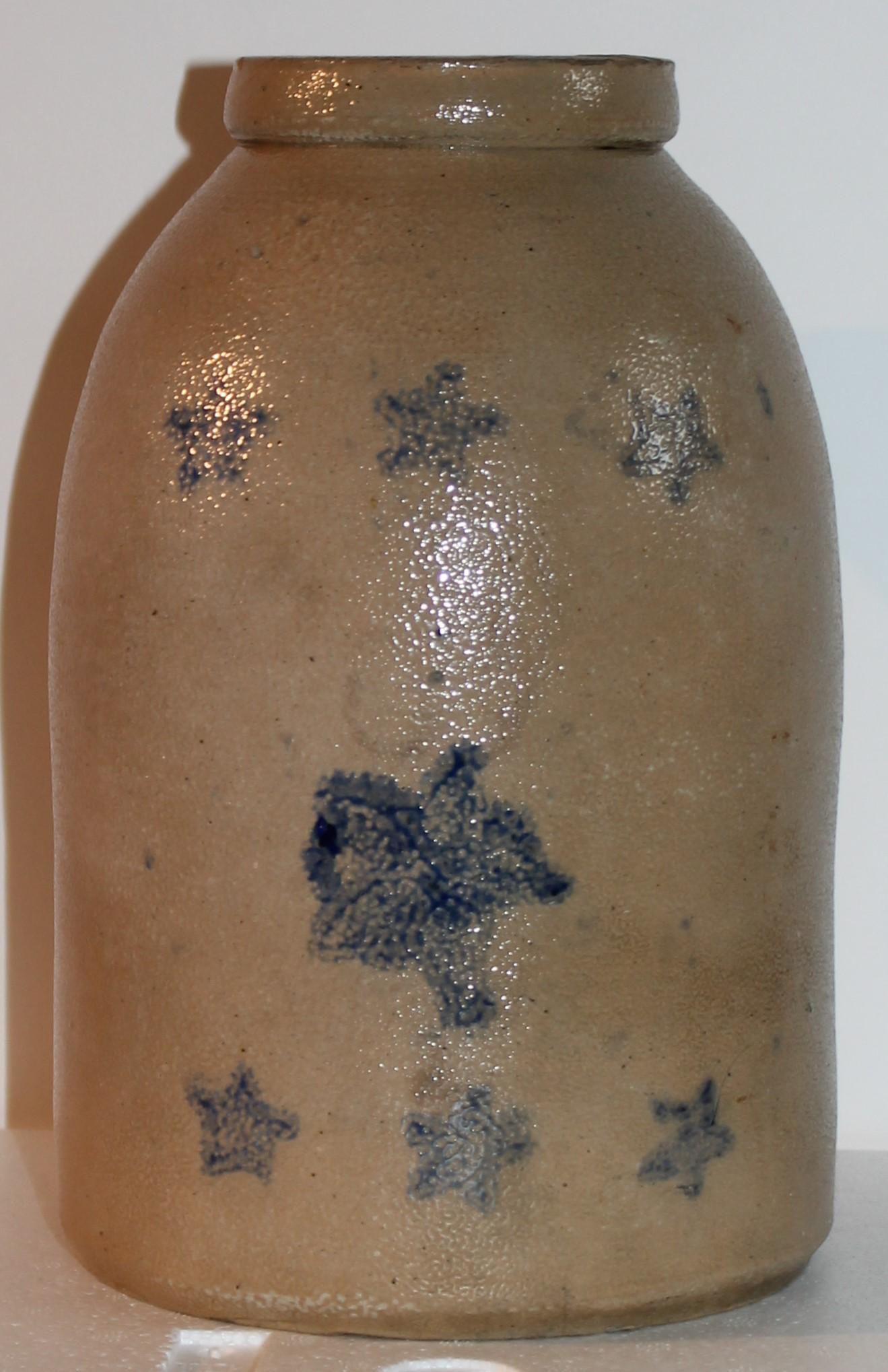 This fine salt glazed stoneware jar or storage jar has blue floating stars all over the face of the crock. It is in fine condition with no cracks a few minor chips around the inside rim. This is a fantastic folk art stoneware crock. Let’s call it
