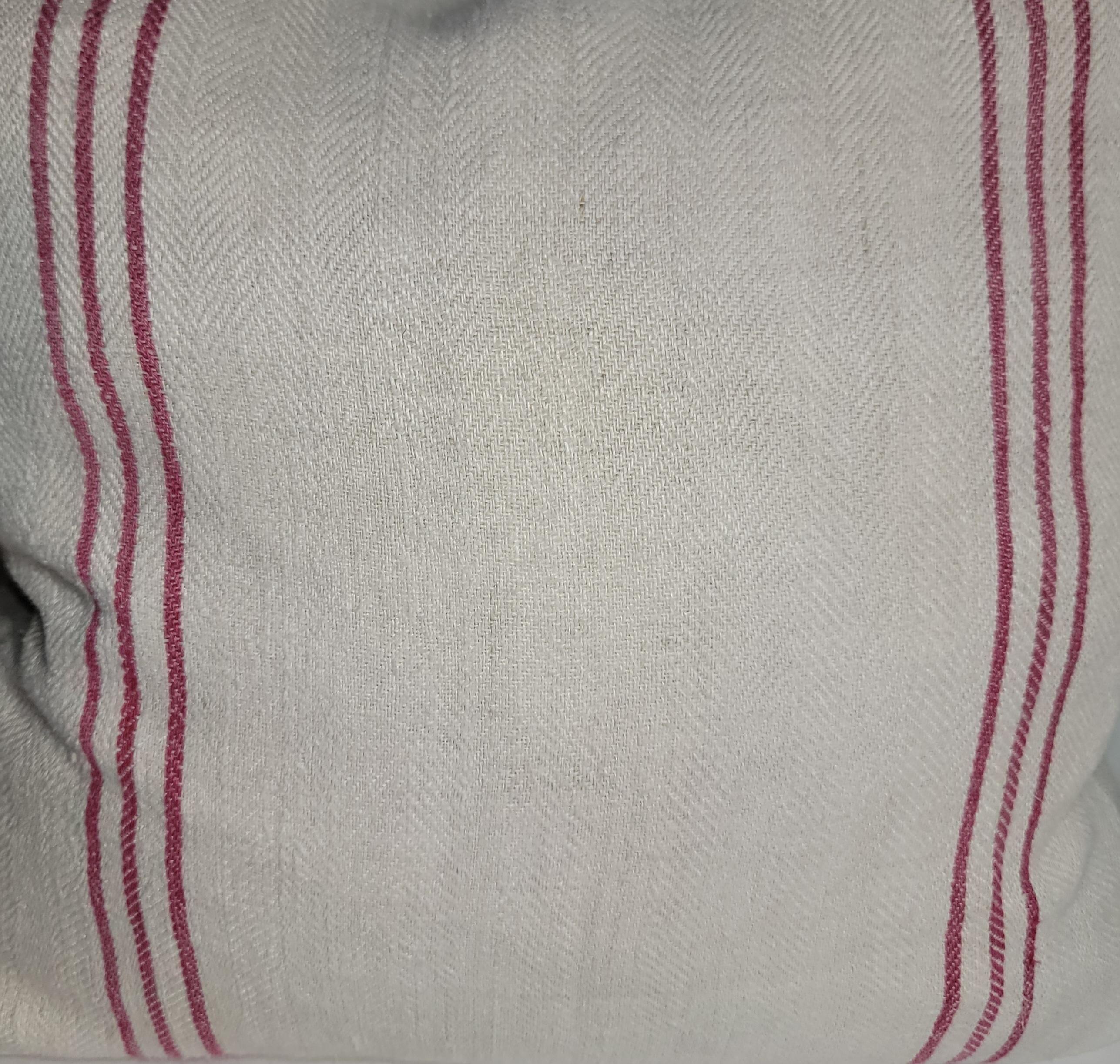 19thc Striped Cotton Linen Double Sided Pillows. This beautiful linen has simple red lines on one side of the pillow that are very attractive and the backing is a plain linen. The linen has been professionally laundered and has down and feather