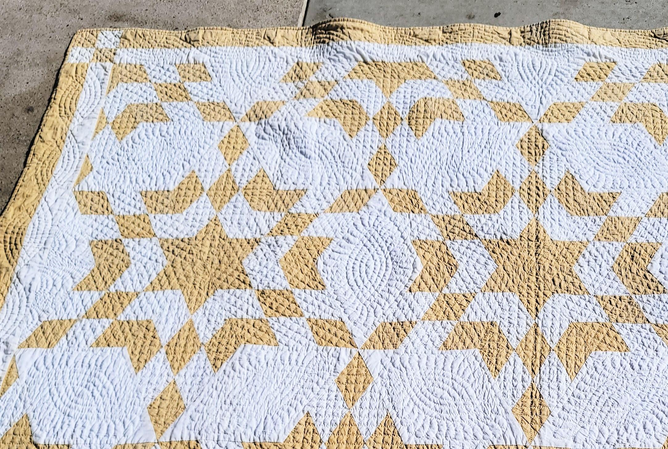 19Thc Tan & white geometric star quilt from Pennsylvania in fine condition. This quilt has very fine quilting and nice piecework.