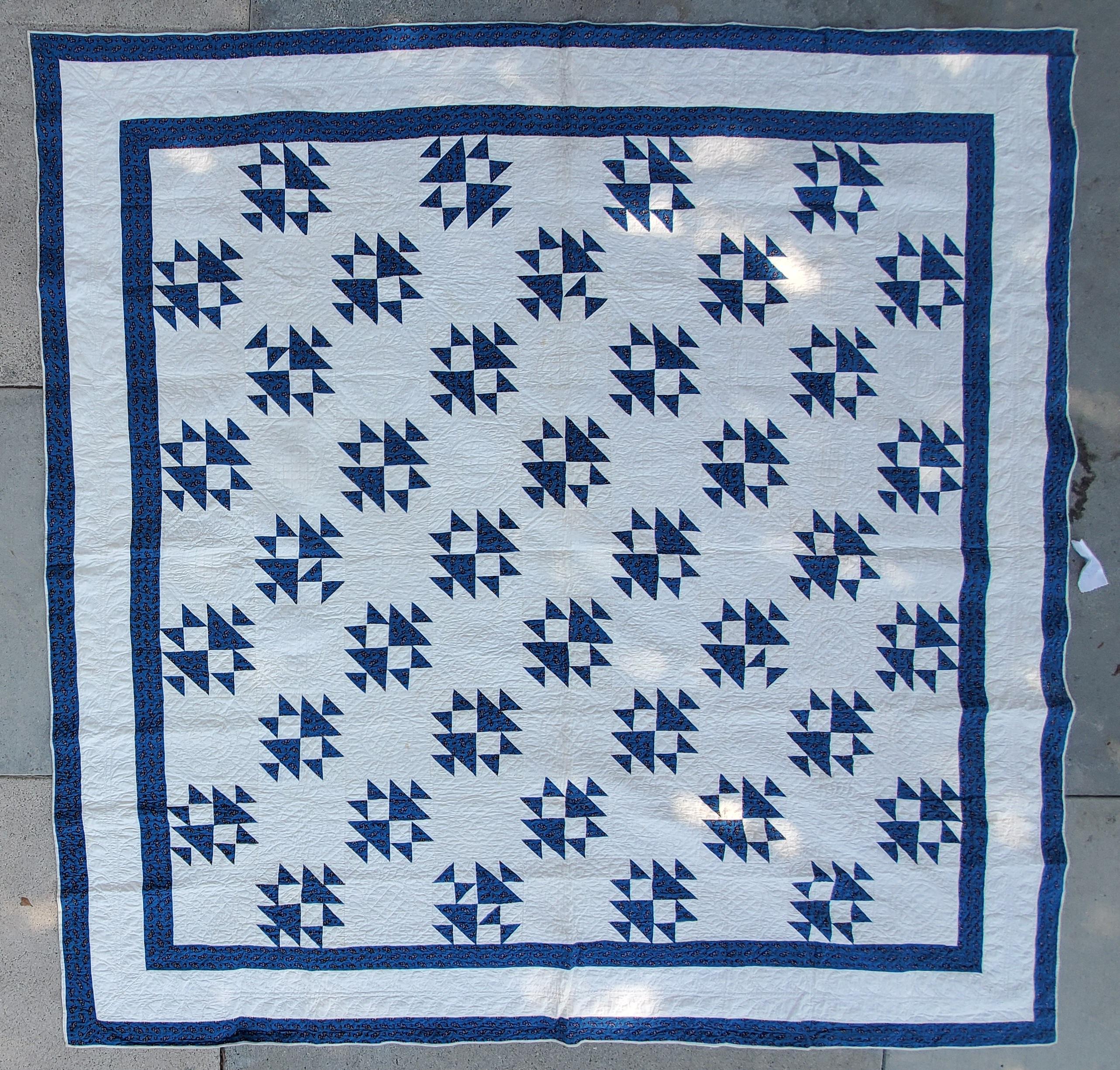 This amazing 19thc teal calico printed & white shoe fly pattern quilt from New England is quite unusual. This amazing quilt has Fine quilting and very Fine condition. This quilt has double inner borders which frames it nicely.