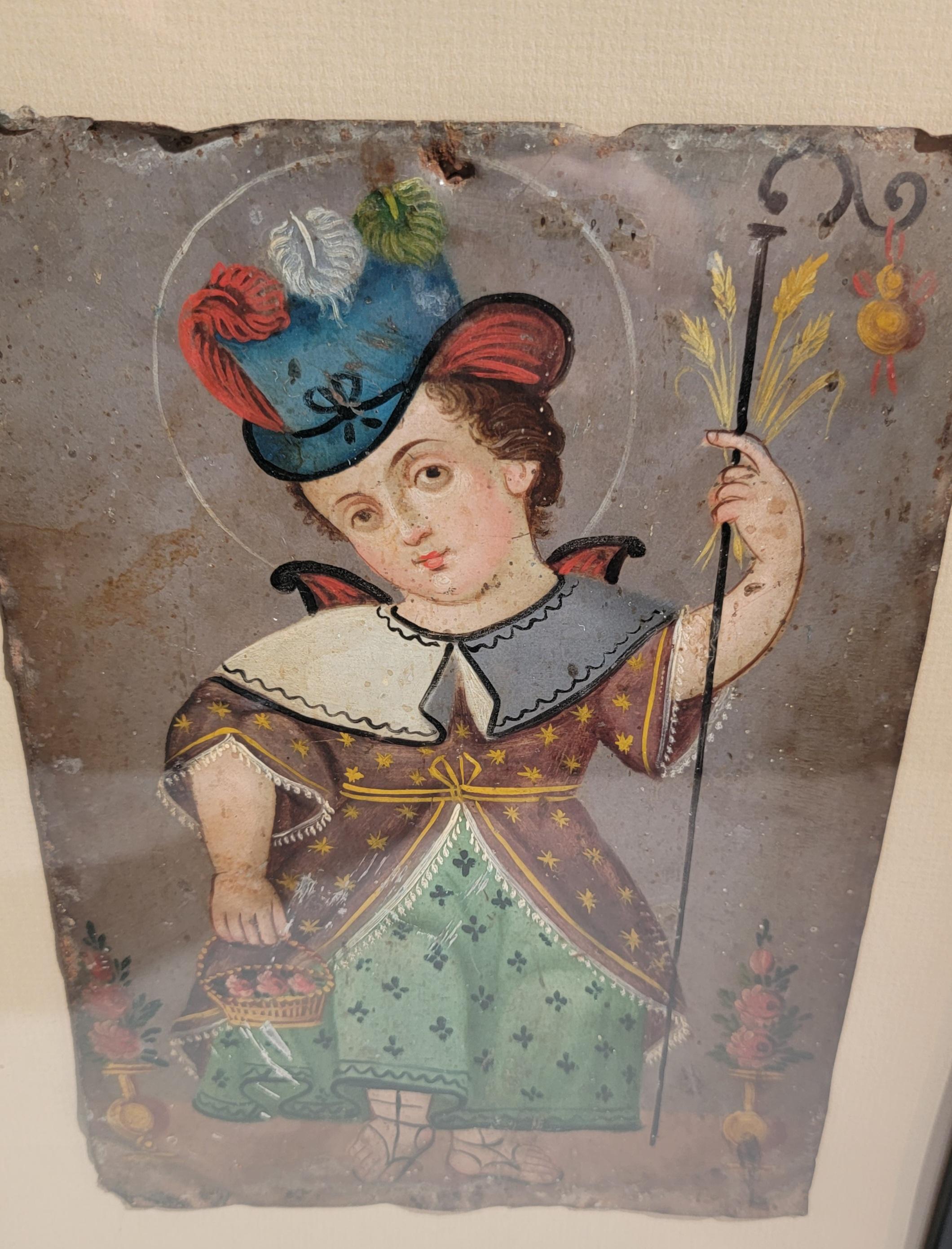 Ein Retablo ist ein Andachtsbild, insbesondere ein kleines volkstümliches oder volkstümliches Gemälde, dessen Ikonographie von der traditionellen katholischen Kirchenkunst abgeleitet ist. Es stellt einen Heiligen und ein Kind dar, die aufgemalt