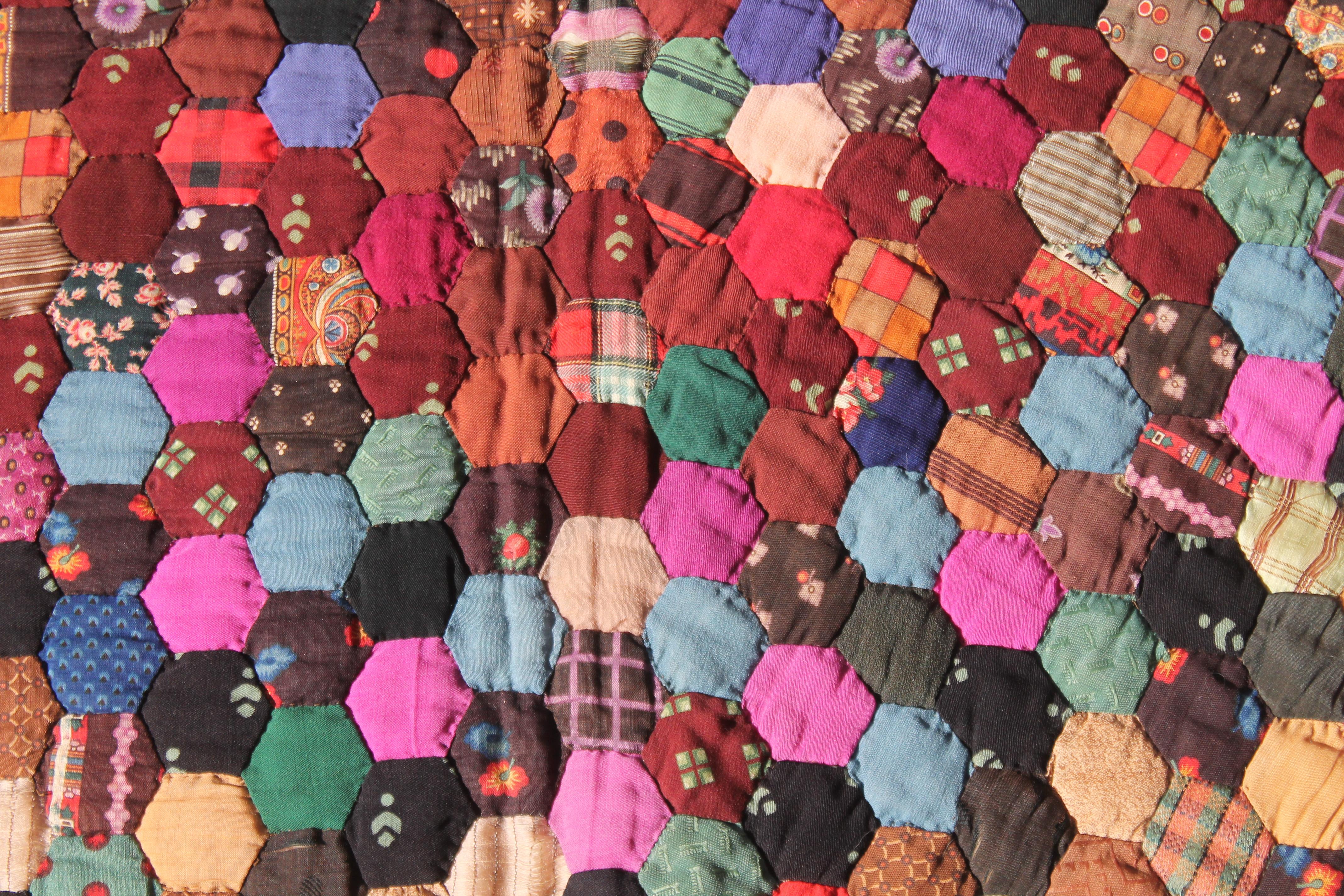 This fine New England wool tiny pieced Hexagon quilt is in amazing condition and is made up of wool challis.