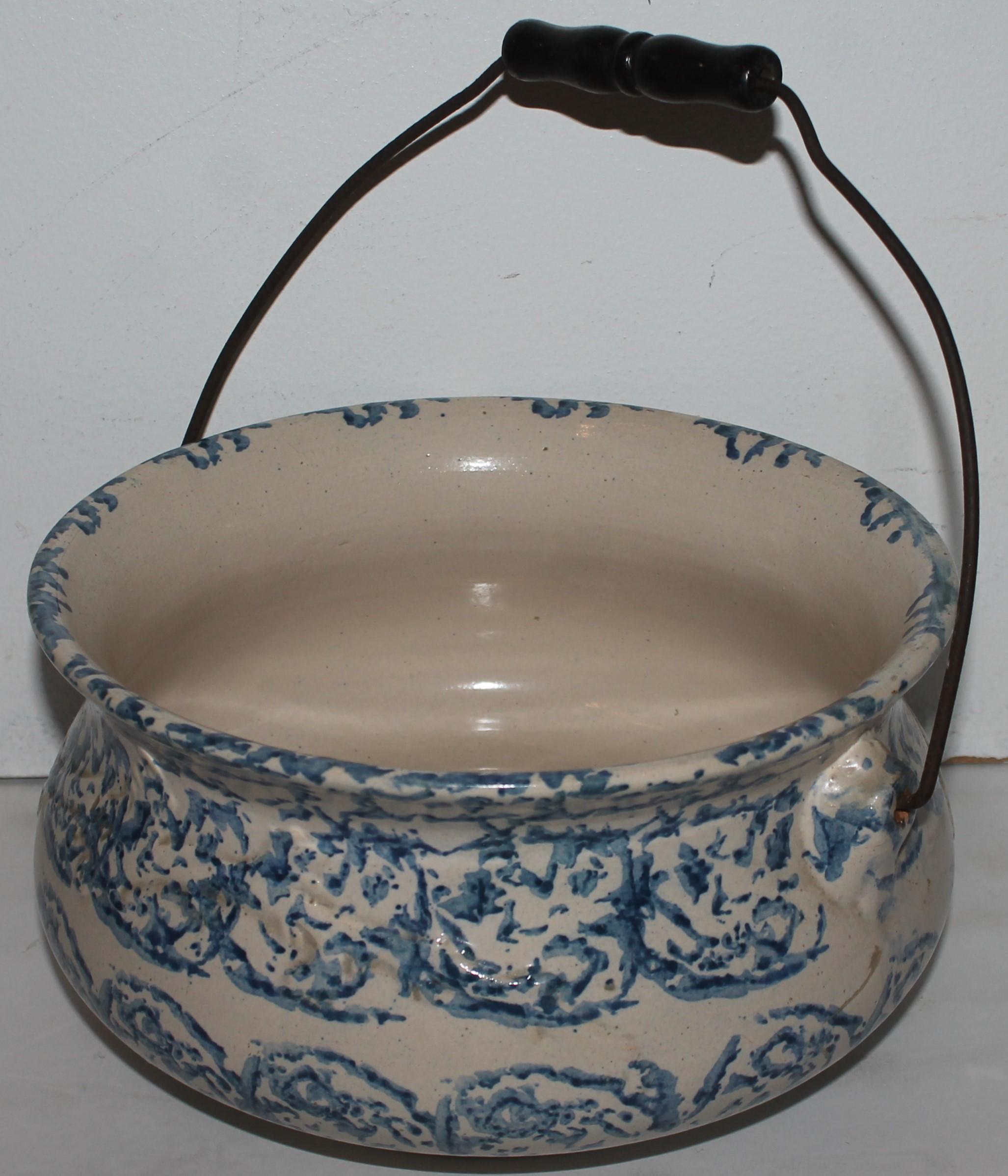 This most unusual shape sponge ware pottery bucket is in very good condition. It has the original bail handle and in fine condition.