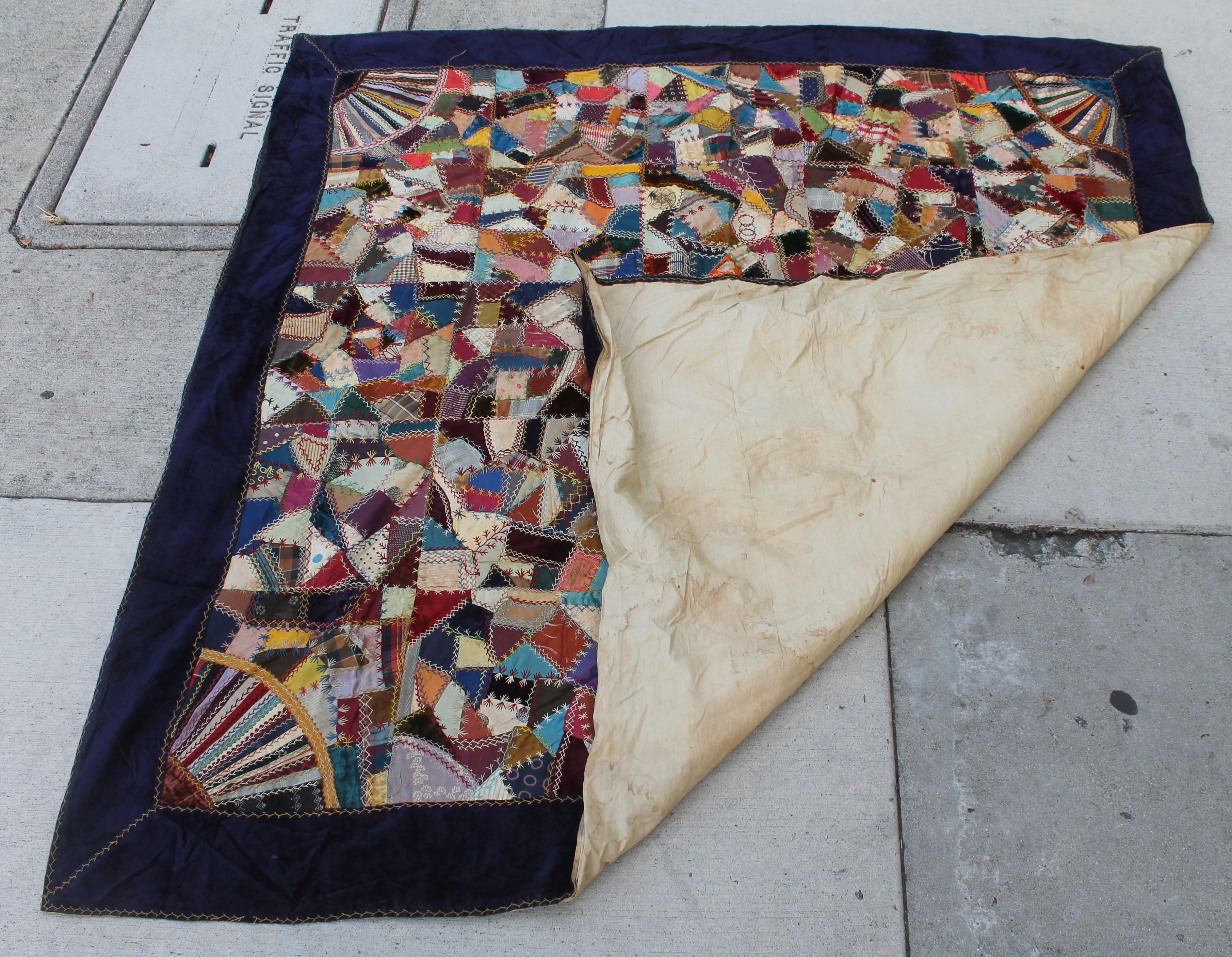 19th century velvet and silk crazy quilt with blue velvet border. Mini pieced crazy quilt.