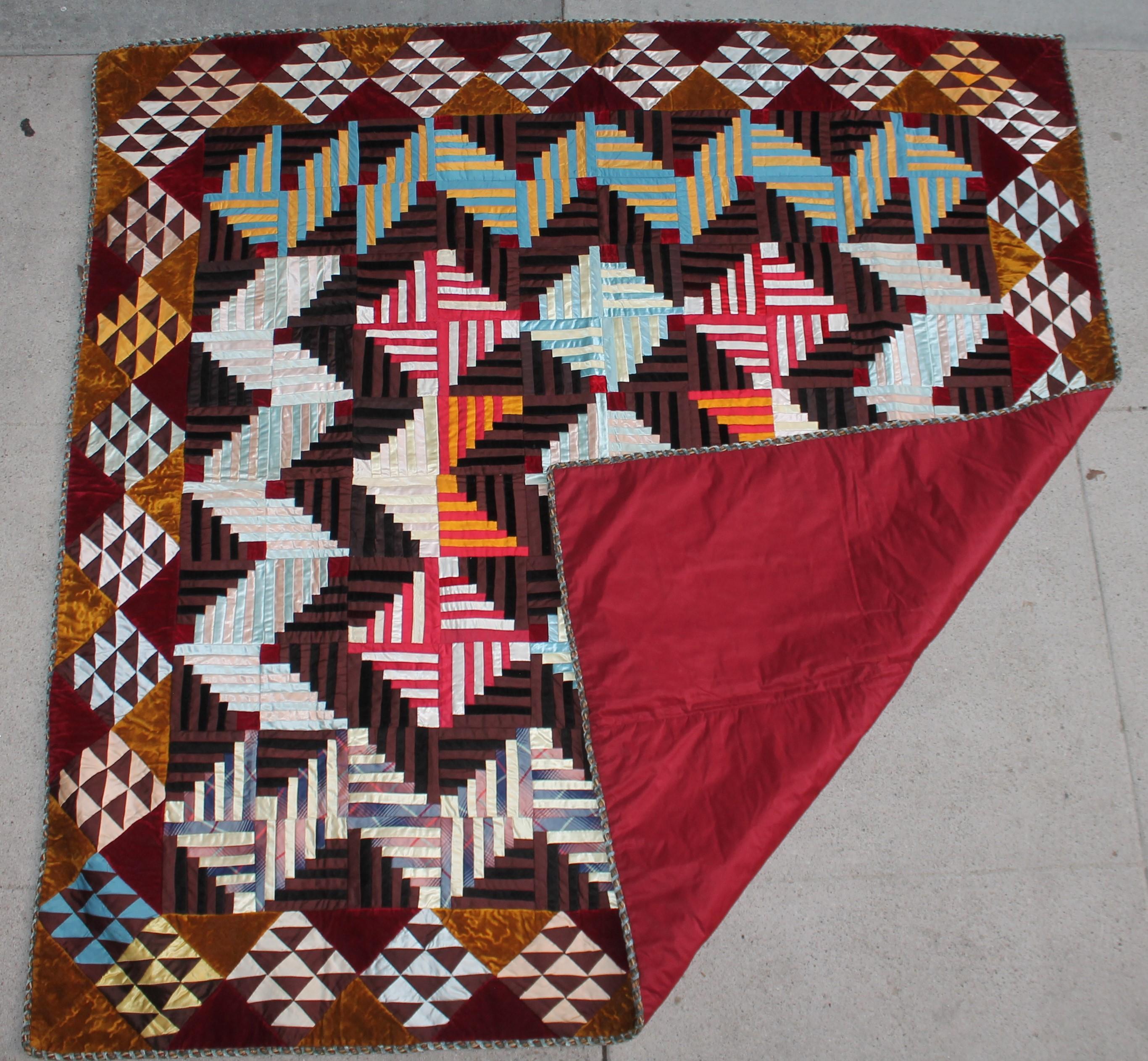 This amazing log cabin / barn raising silk & velvet quilt is in amazing mint condition. This comes to us from a private family estate collection in Beverly Hills, California. The backing is a burgundy silk fabric.
