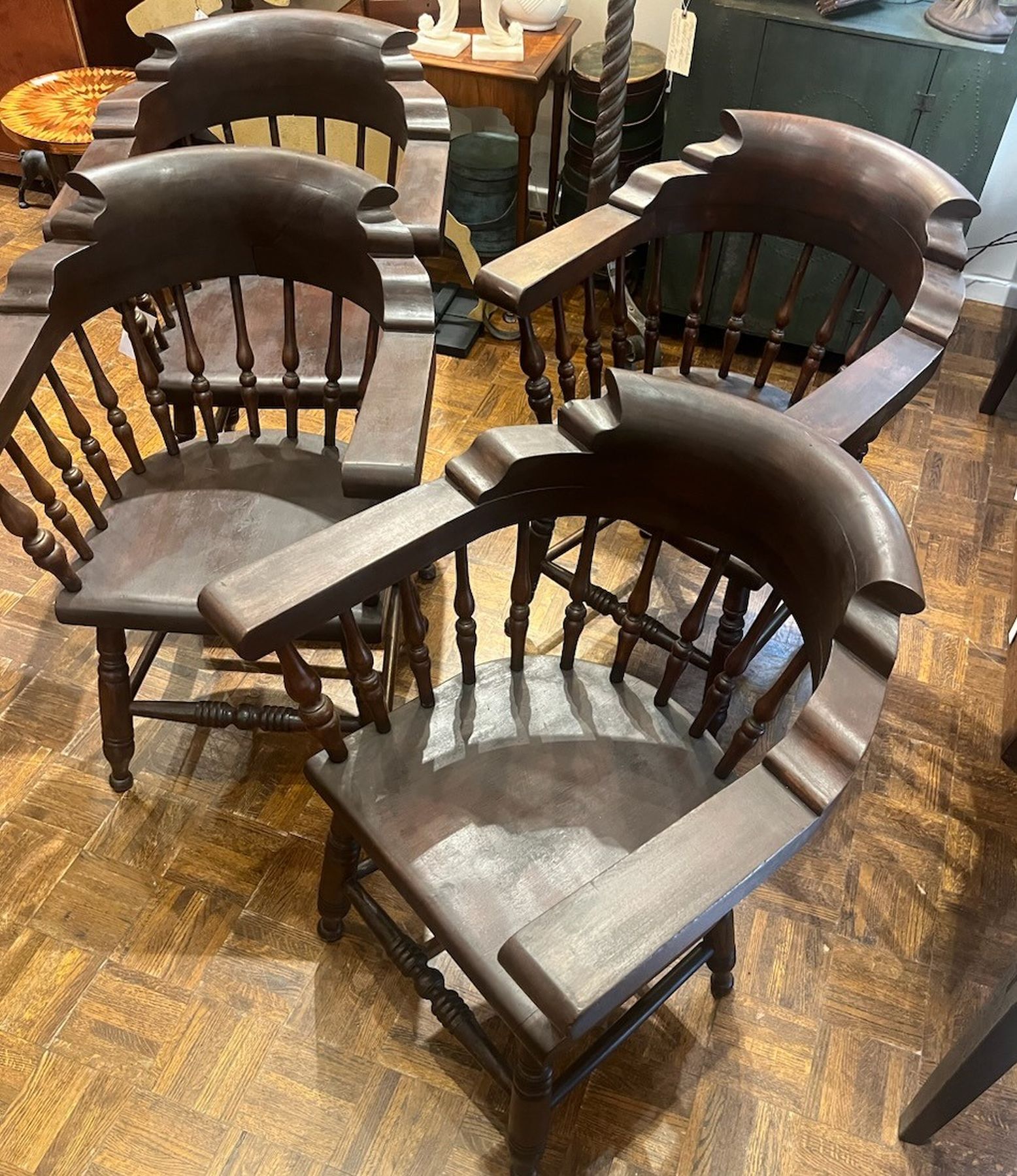19Thc Walnut captains arm chairs in fine condition and very sturdy.These arm chairs have a beautiful patina and very nice turnings to the spindles. Sold as a set of four only and super comfortable !