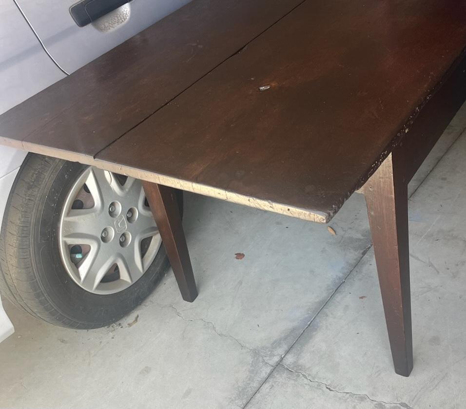 This amazing two board top walnut harvest table has the taper legs and wood peg construction. This eight foot table was found in Zoar ,Ohio. The table top is completely removable. The drawer face is original but the drawer guts are newly redone. The