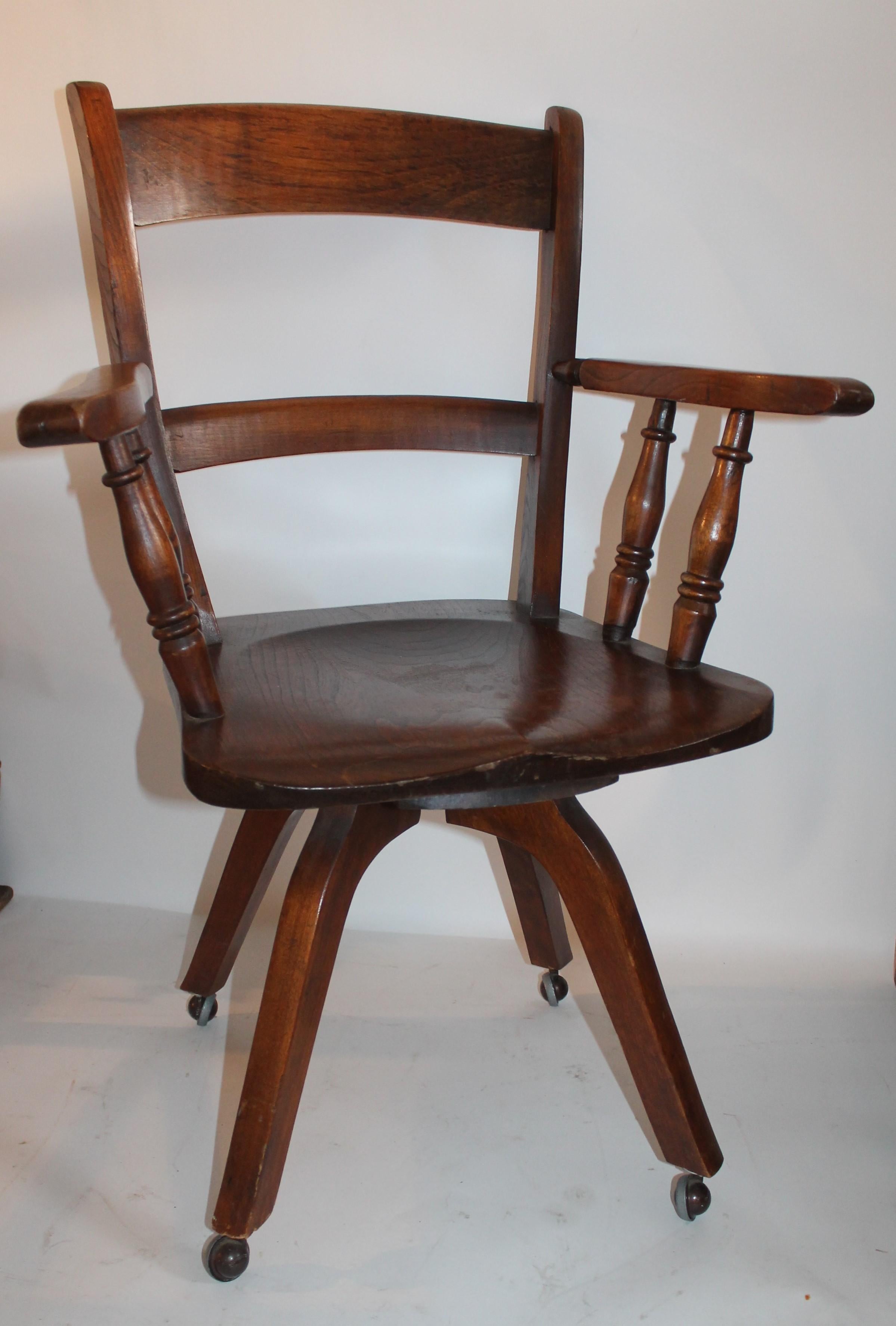 This fine swivel walnut office chair is on wheels and in pristine condition. The wheels are new and in great working order.