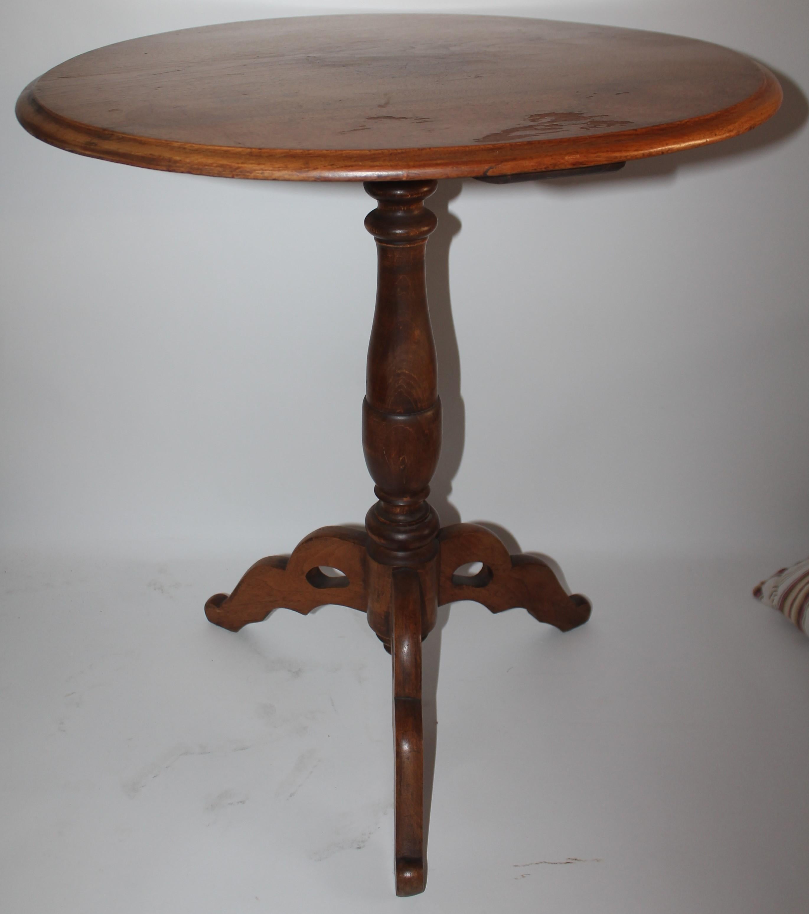 19thc round side table in fantastic condition with a hand carved base. Found in New England and in fine condition.