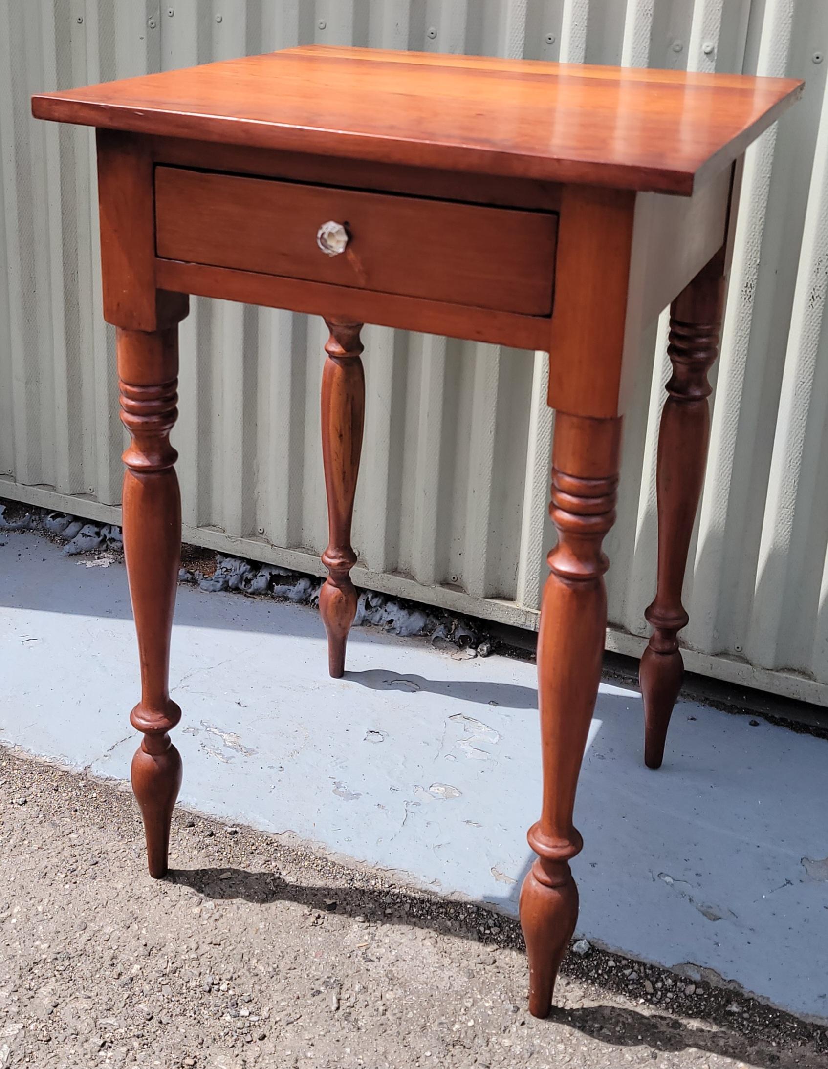 19th century tall walnut one drawer nightstand with original glass drawer pull.The drawer is dovetailed construction and pegged throughout.The condition is amazing and tall turned legs are finely carved.