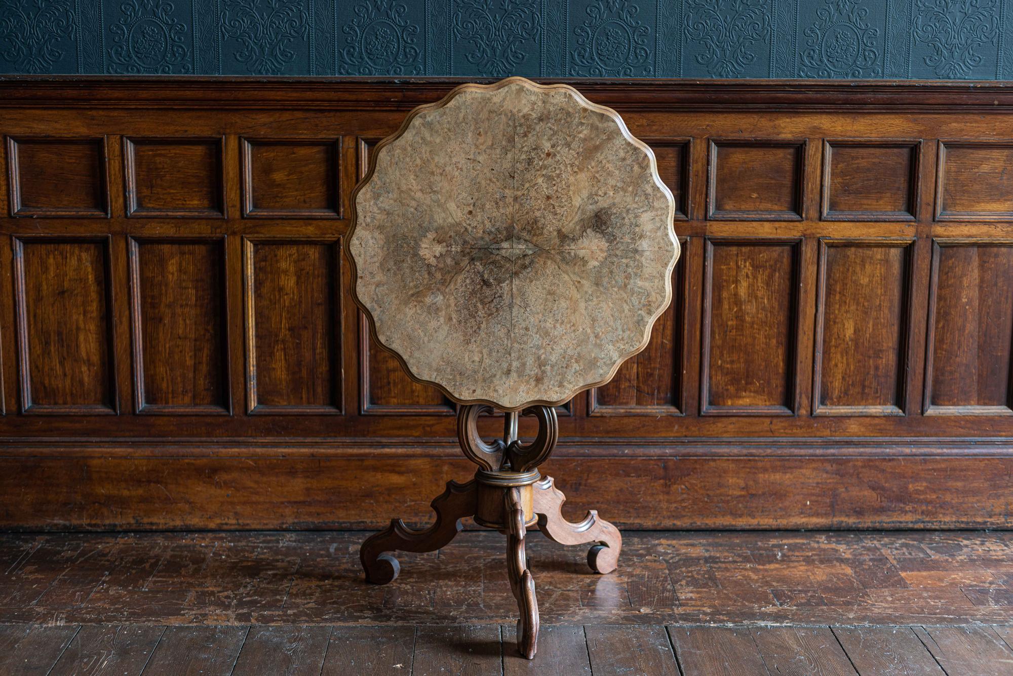 19th century walnut tilt-top centre table
circa 1870.

Burr top with pie crust edge, on out swept scrolling column and base.

Measures: 72 height x 66 diameter cm.