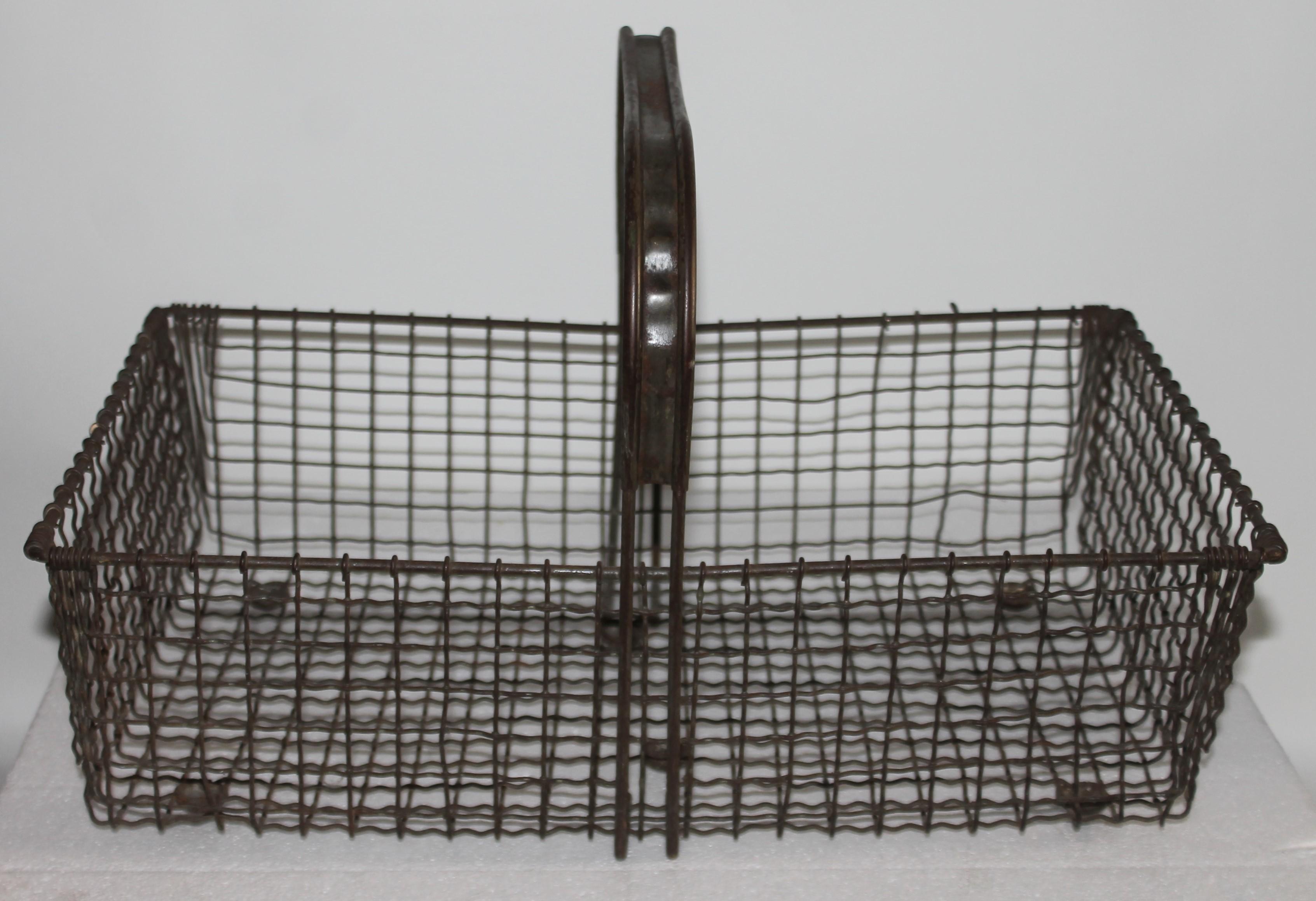 This fantastic wire veggy basket could be for shopping at the farmers market or gathering vegetables in the fields. It is in great condition.