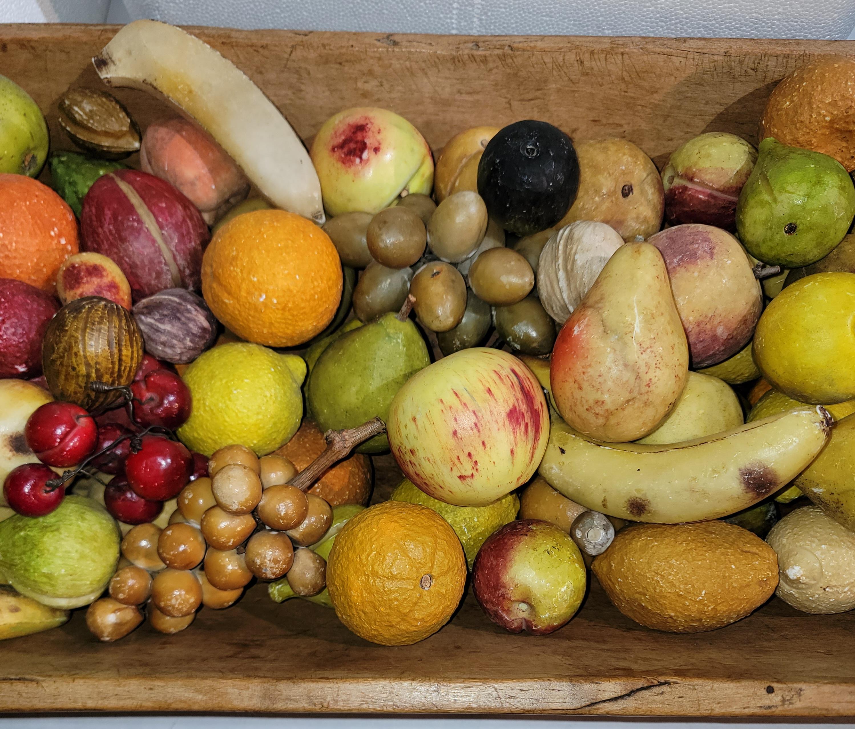 Hand made 19thc dough bowl with 125 assorted stone fruits and nuts. Great amazing collection of stone fruit from one collector. This may be packed in 3 boxes for safety and weight conservation.

Due to the amount of weight that the stone pieces ca