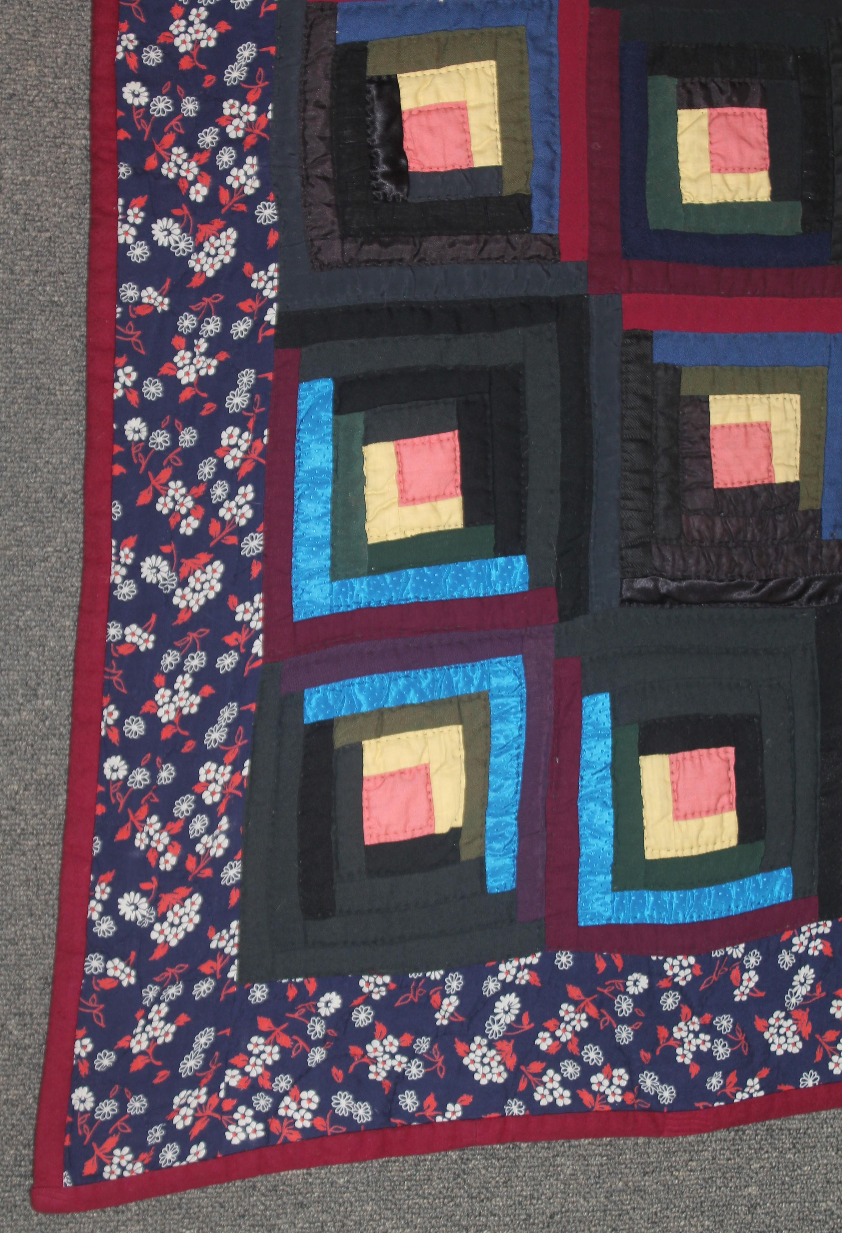 19thc wool & satin log cabin barn raising quilt and has a wool flannel backing. This quilt is in pristine condition.