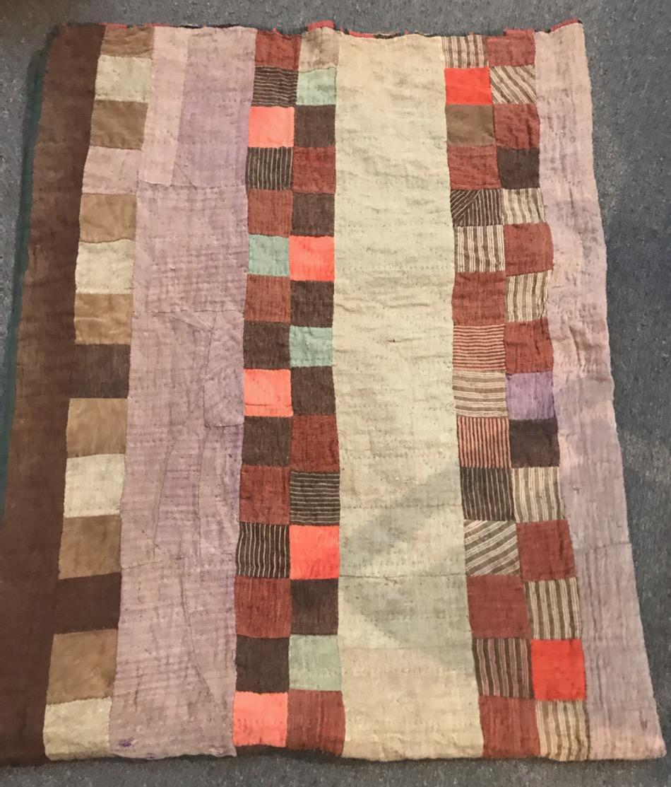 This 19th century four patch bars quilt is Afro-American quilt in wool and Lindsey Woolsey. The backing has a very early woolen stripped fabric and pieced together. The bidding edge is worn as to be expected given the age of the quilt and usage.