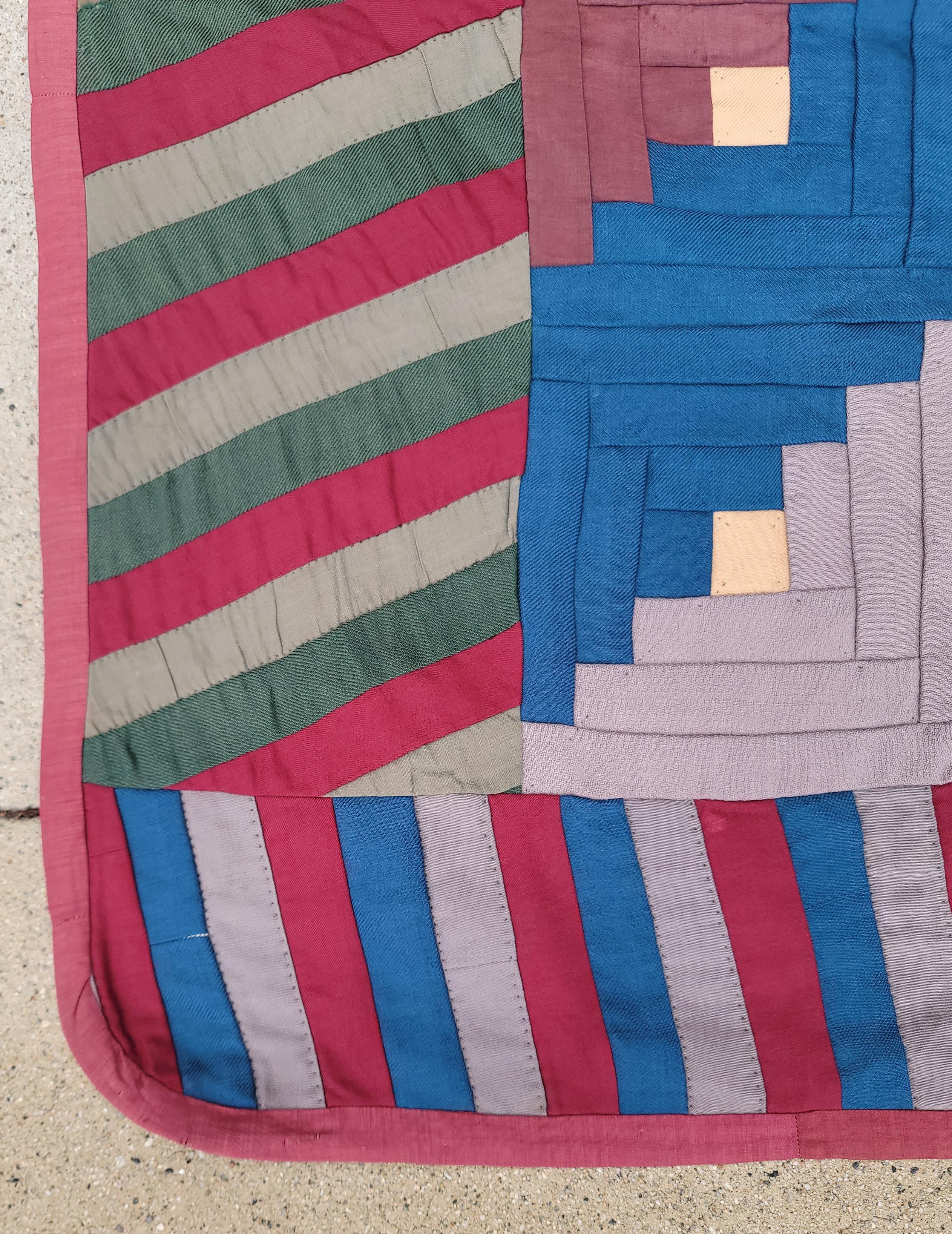 This amazing all wool chalis straight furlows pattern log cabin quilt from Lancaster County,Pennsylvania is in pristine condition.The striped border is a fantastic finish to complete the quilt pattern.