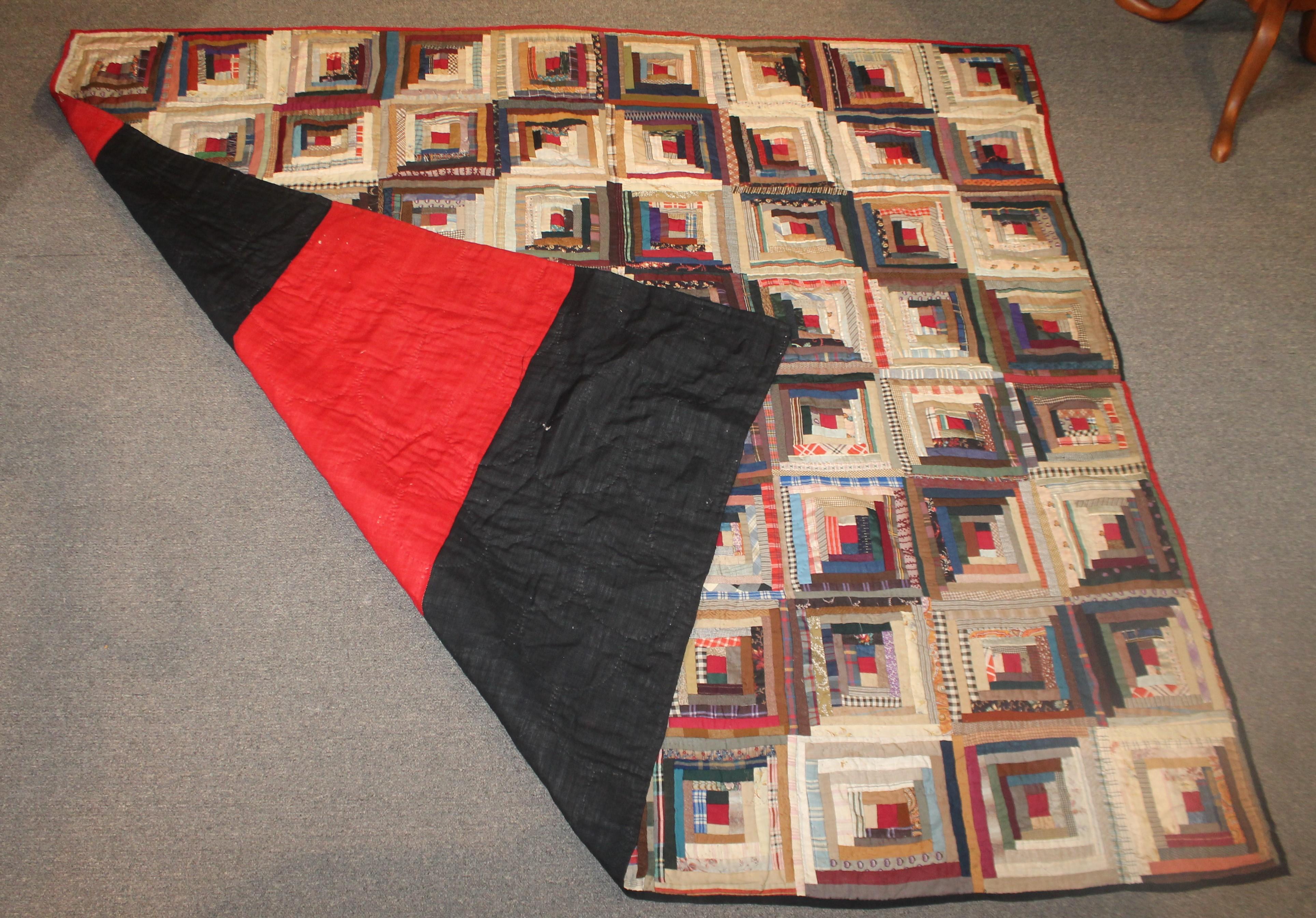 19th century wool log cabin quilt in good condition. This was found in central Pennsylvania. It has a red and black wool bars backing.
