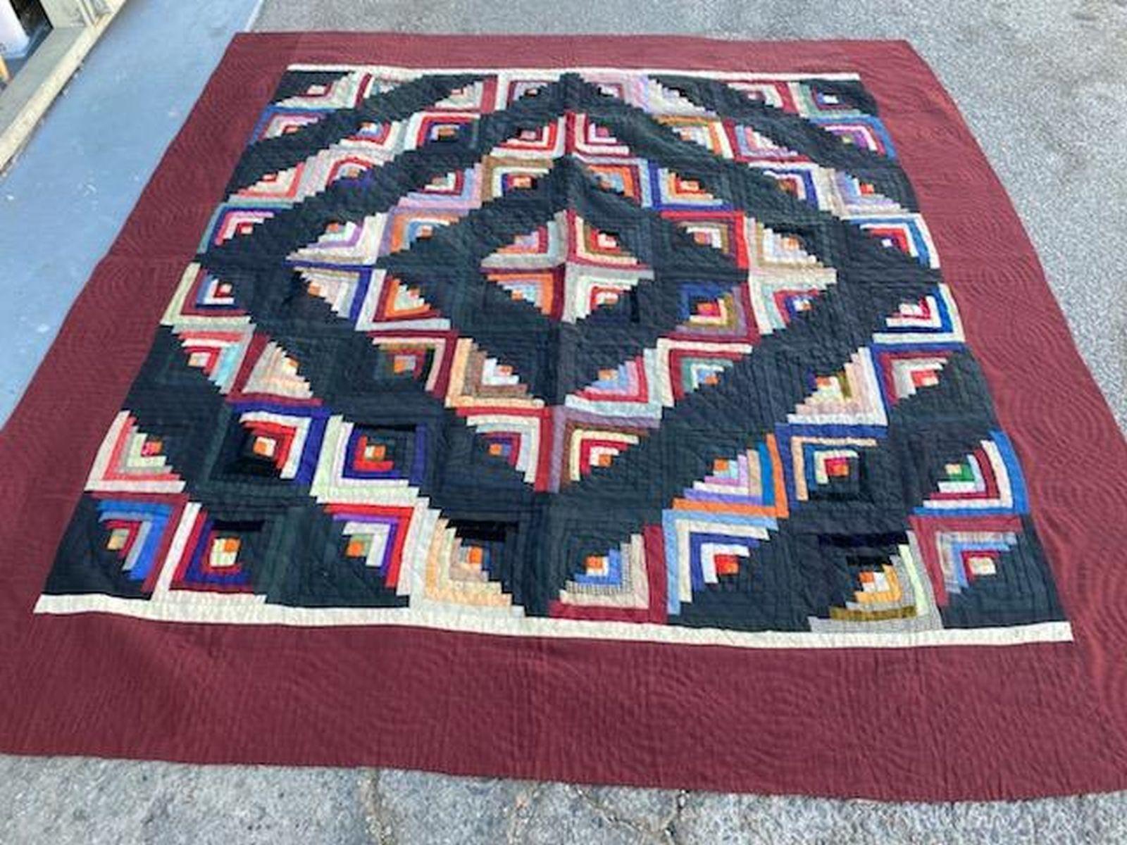 19th century wool log cabin quilt in fine condition with a bars backing. The condition is very good.