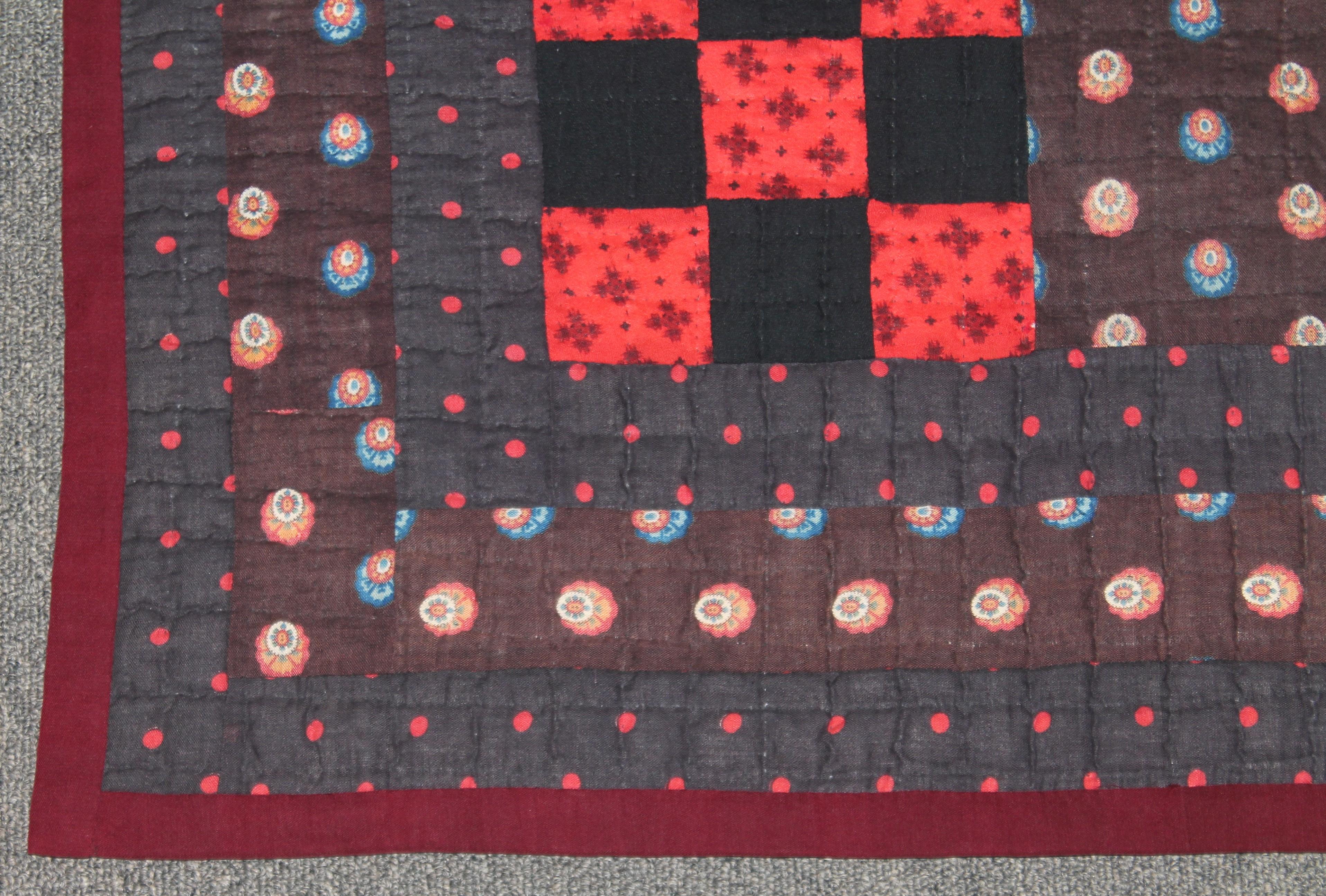 This fine wool challis nine patch quilt is from Lancaster County, Pennsylvania and is in mint condition. These fine gem tones with a brown back round stands out like head lights in the dark. Such a fine example of wool challis mix.