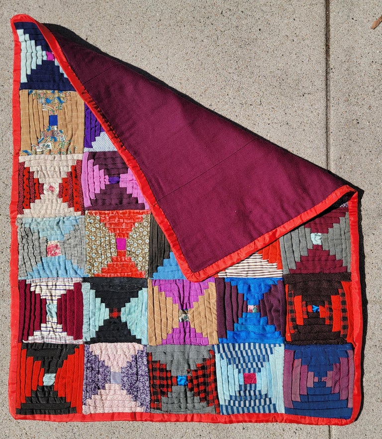 This fine mini pieced 19th C crib quilt is made up of wool & wool challis and has mixed fabrics with silk binding and some blocks are silk too. The condition is very good.This beauty was found in New England. Amazing scale & condition.