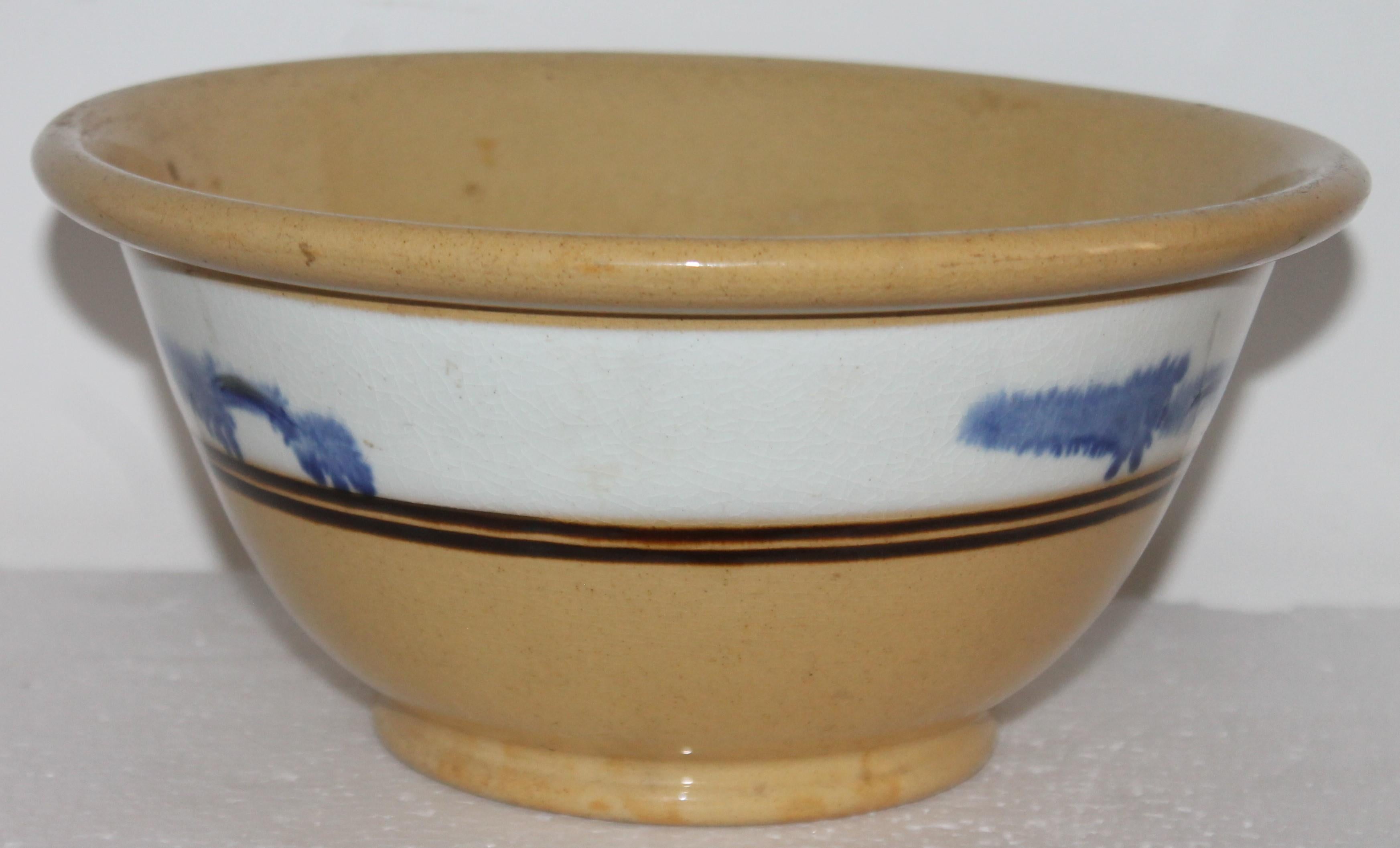 yellow ware bowl with blue stripes