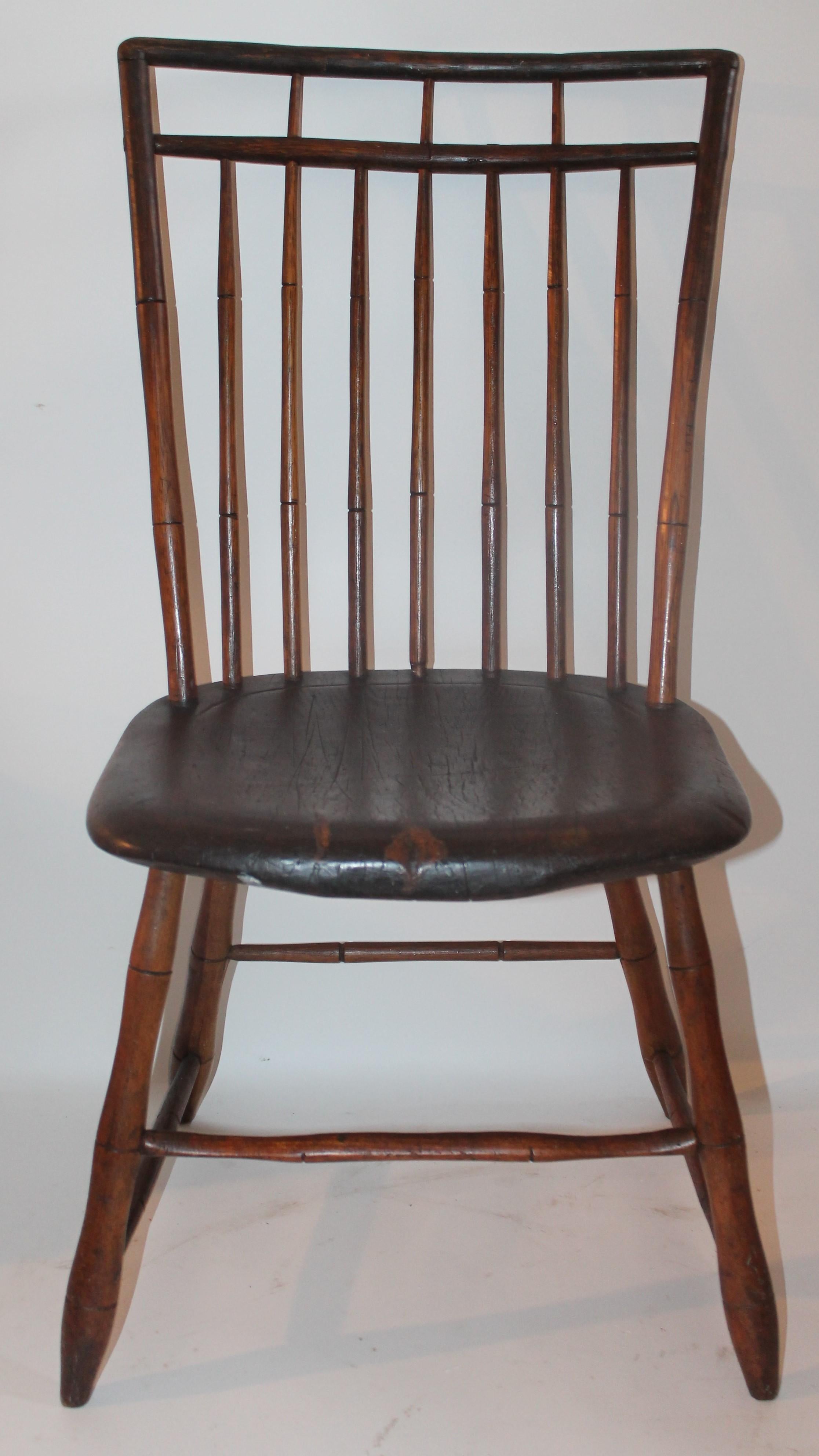 This fine saddle seat bird cage Windsor chair is in great as found condition. This chair has a wonderful aged and worn patina.