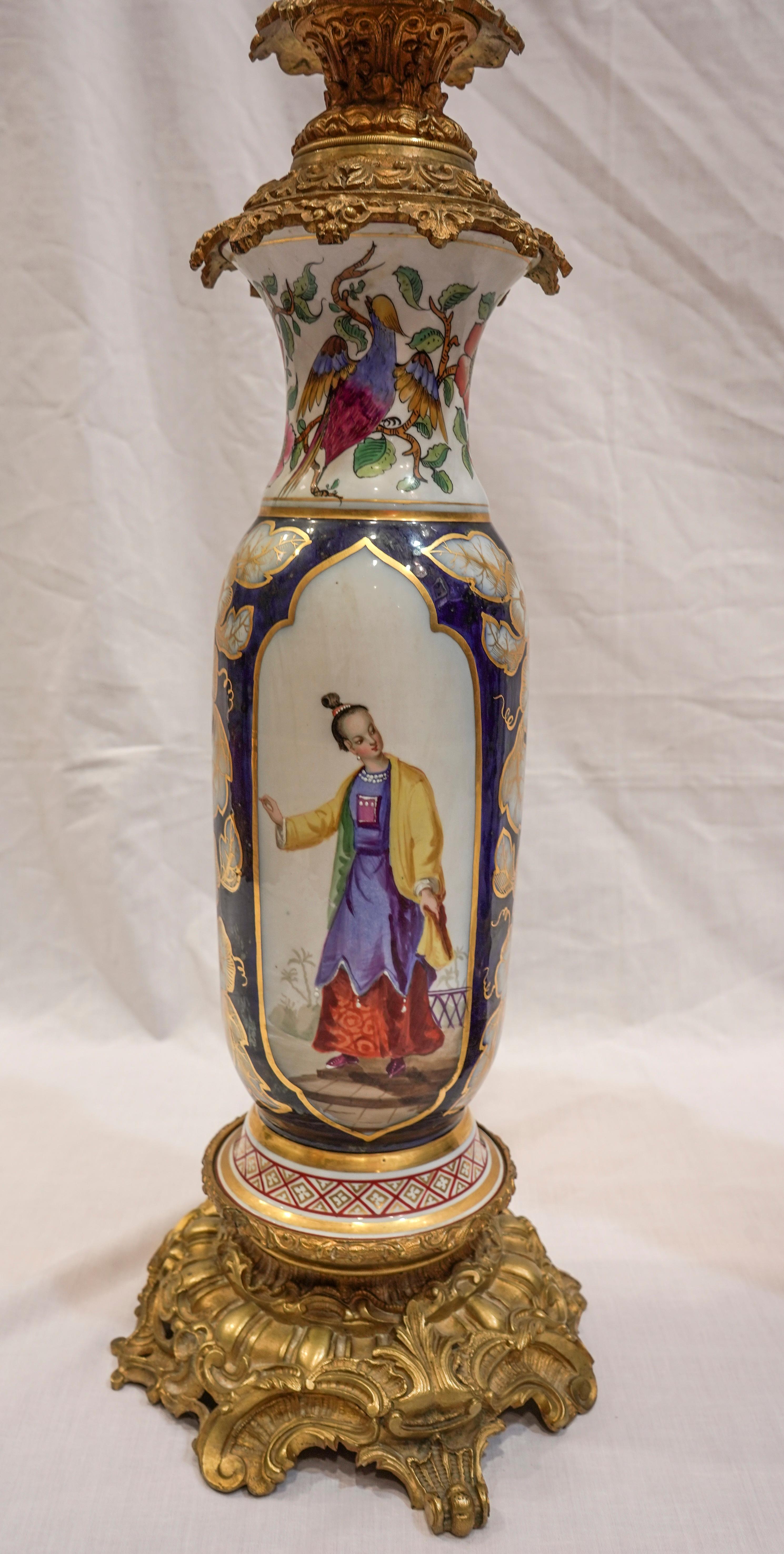 A one of a kind pair of Samson porcelain vases made oil lampes with cobalt blue and plychromy floral decoration and figures of Chinese characters dressed in the 18th century hand painted in relief.
Mounted on ormolu based.
They are a excepcional