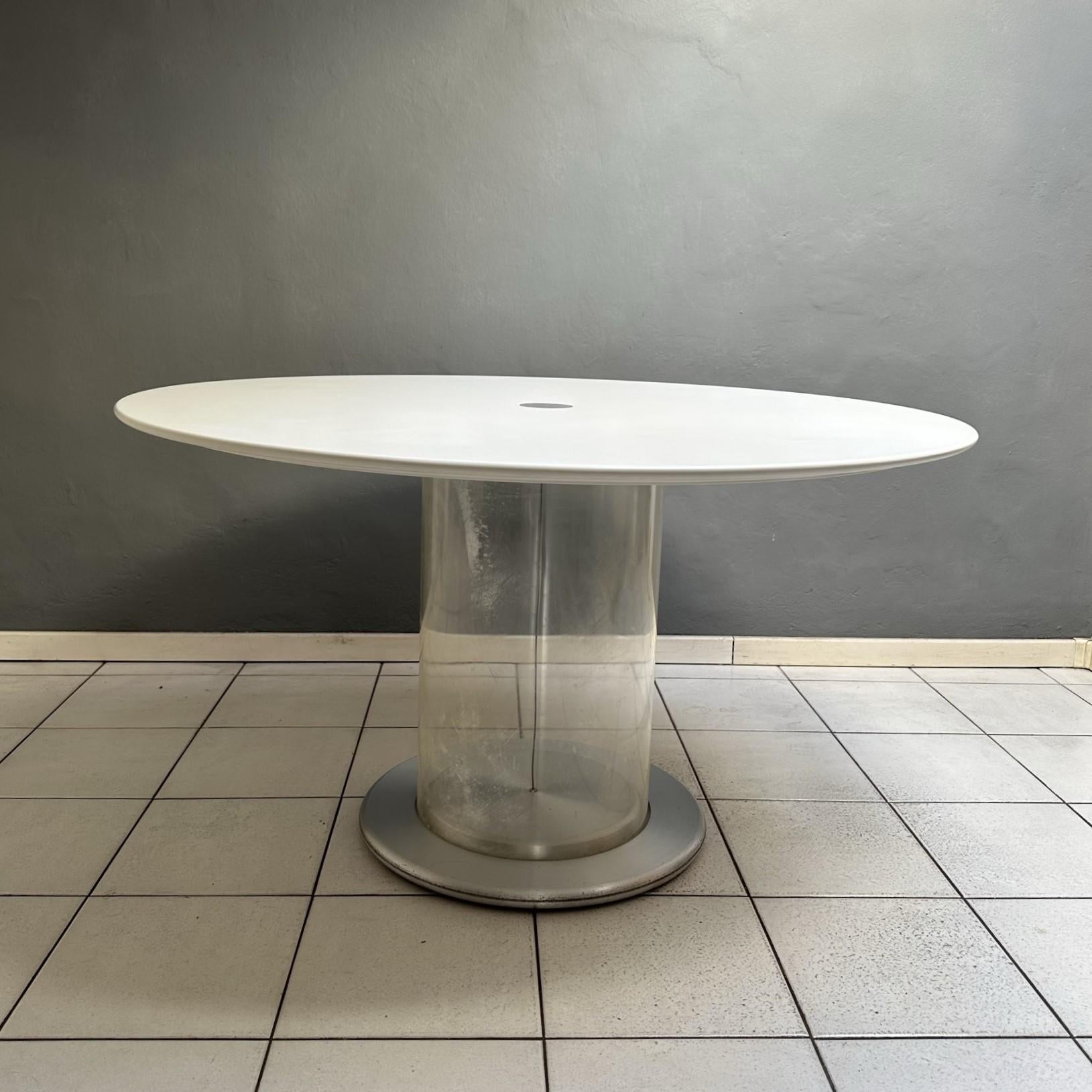 
Eclisse table from the 1960s, Italian manufacturing, design by Claudio Salocchi for Sormani.
Top in matt white lacquered wood, transparent plexiglass structure, aluminum base.
In the attached photos some signs of aging are visible: on the
