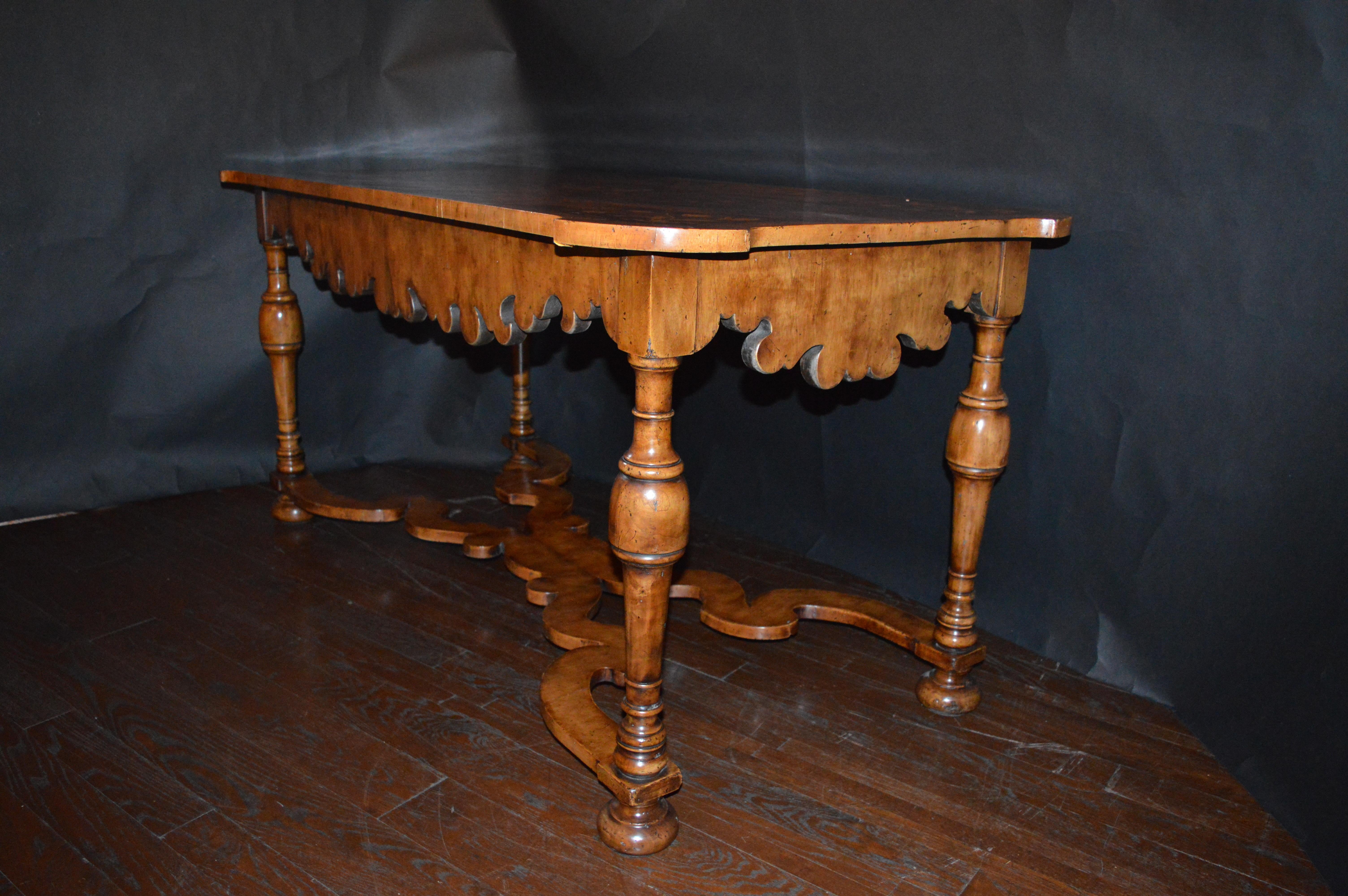 19th century Italian Marquetry inlaid table. Made with walnut, maple, satin and ebony wood.