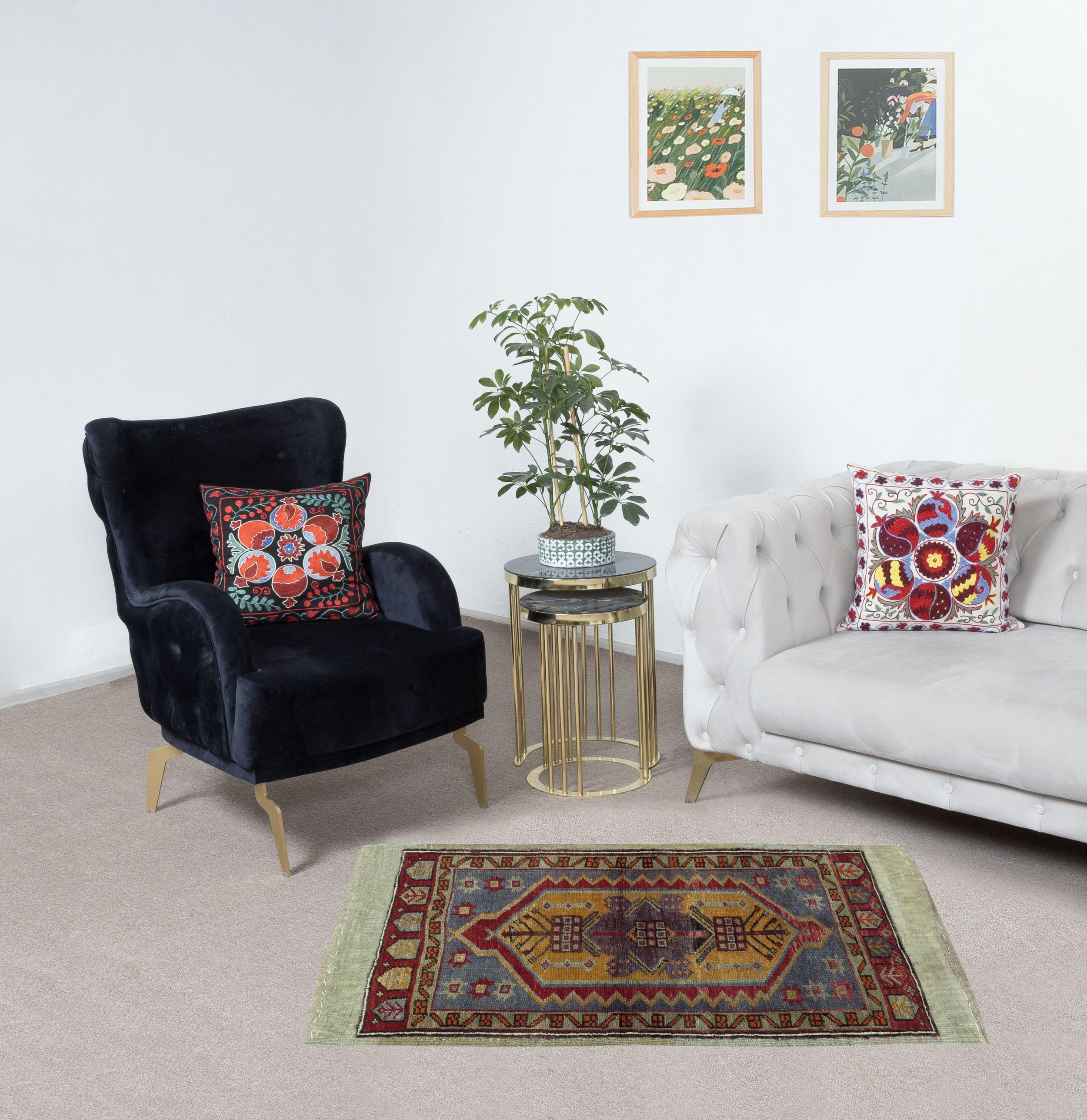 Bring a touch of timeless elegance to your home with this vintage hand-knotted Turkish scatter rug, crafted from 100% wool by skilled artisans. Perfect as a doormat, accent rug, or small decorative piece, this rug embodies centuries-old Anatolian